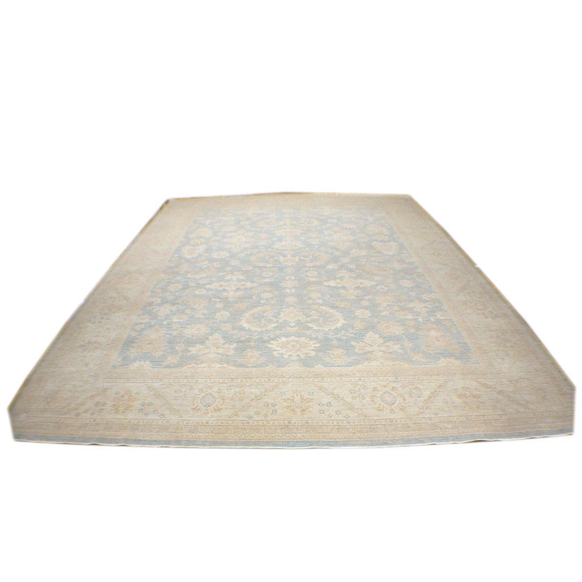 Ashly Fine Rugs presents this beautiful 12x15 Afghan Oushak. As part of our own previous production, this piece was thought of and created in-house and handmade in Afghanistan by our master weavers. This elegant piece has a light blue background,