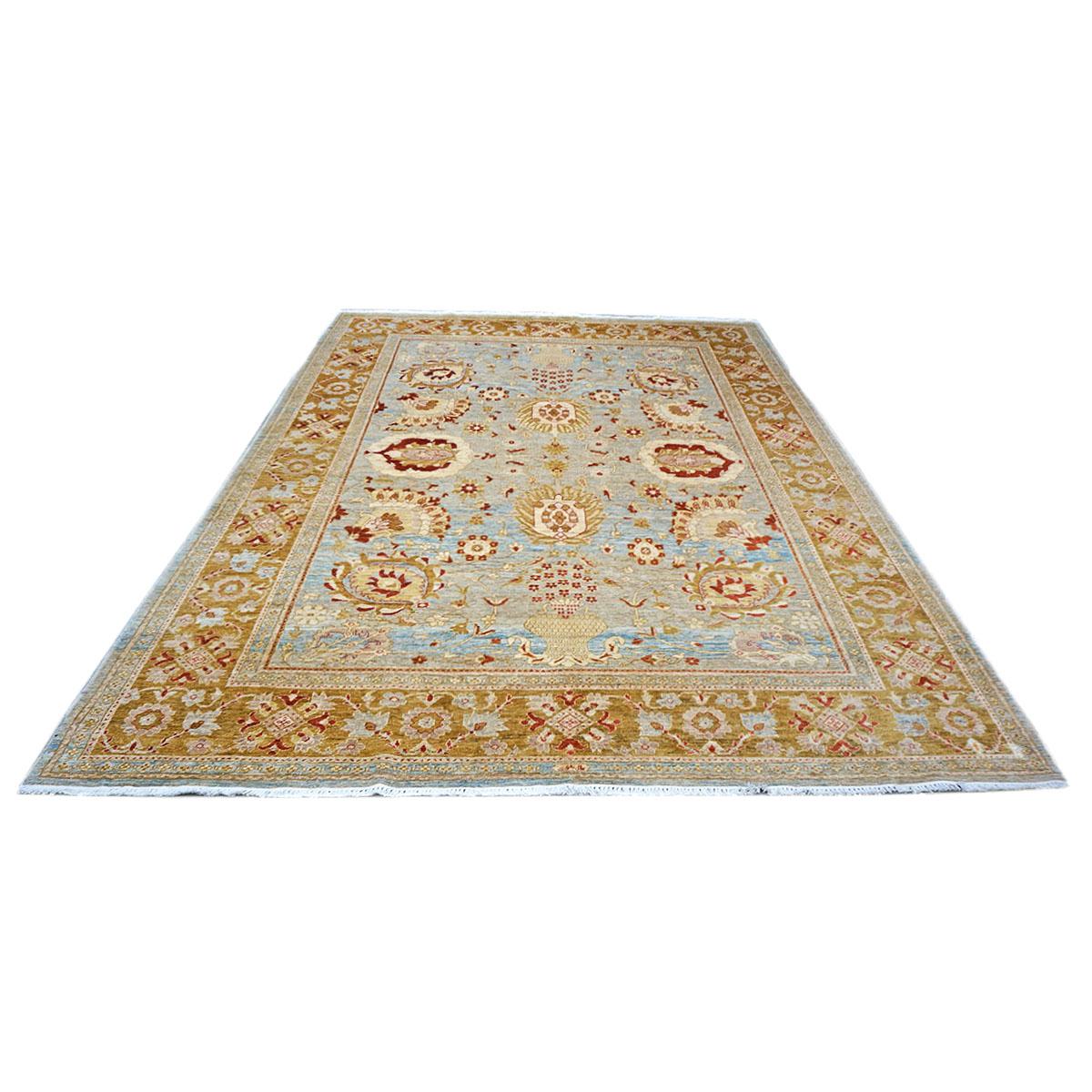 Ashly Fine Rugs presents this beautiful Afghan Oushak 9x12 Blue & Gold Handmade Area Rug. As part of our own previous production, this piece was thought of and created in-house and handmade in Afghanistan by master weavers. This elegant piece has a