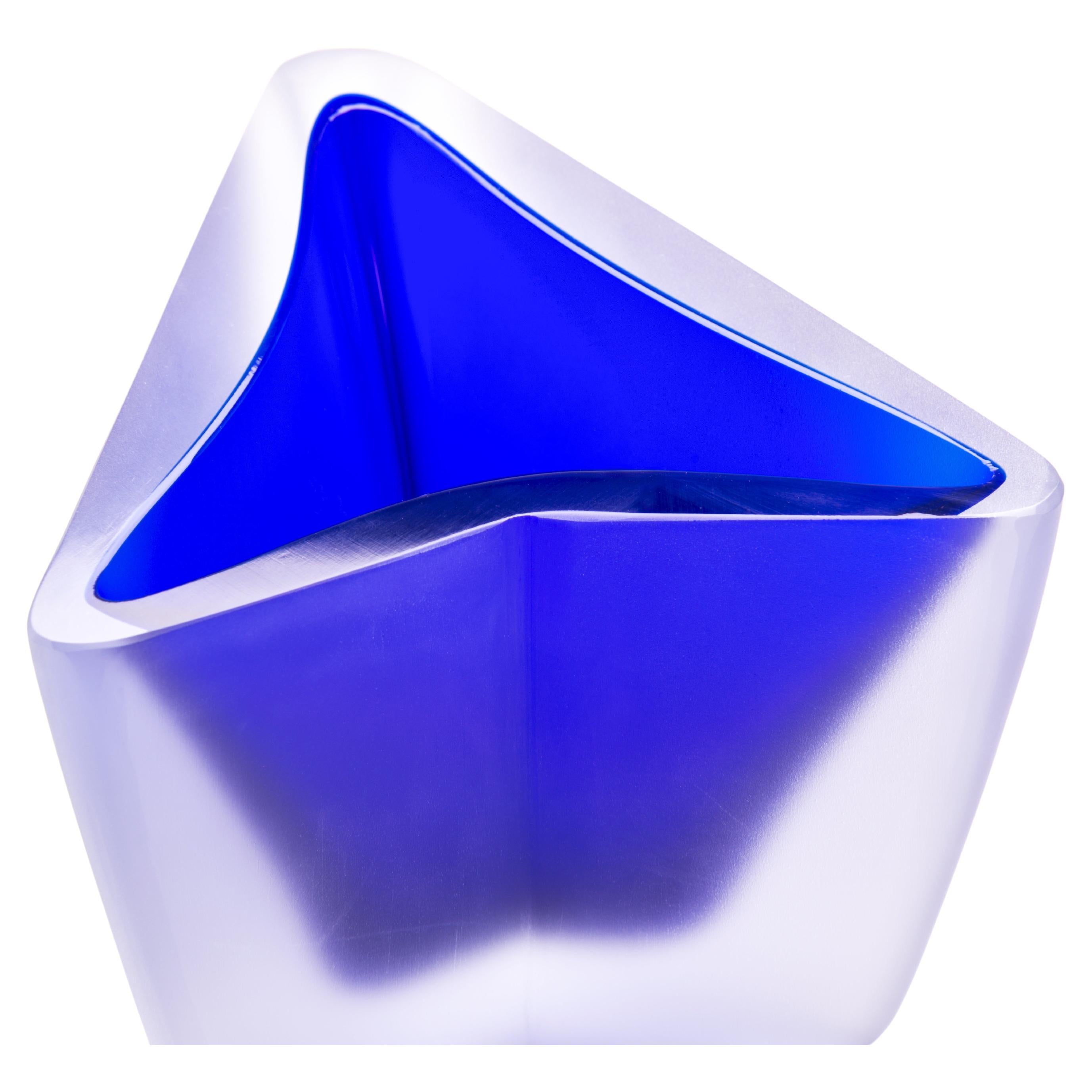 21st century Alessandro Mendini freccia small vase in Murano glass.
Designed by Alessandro Mendini, freccia is a triangular base vase with an integral side which serves to give both direction and an arrow shape. The top is diagonal instead of