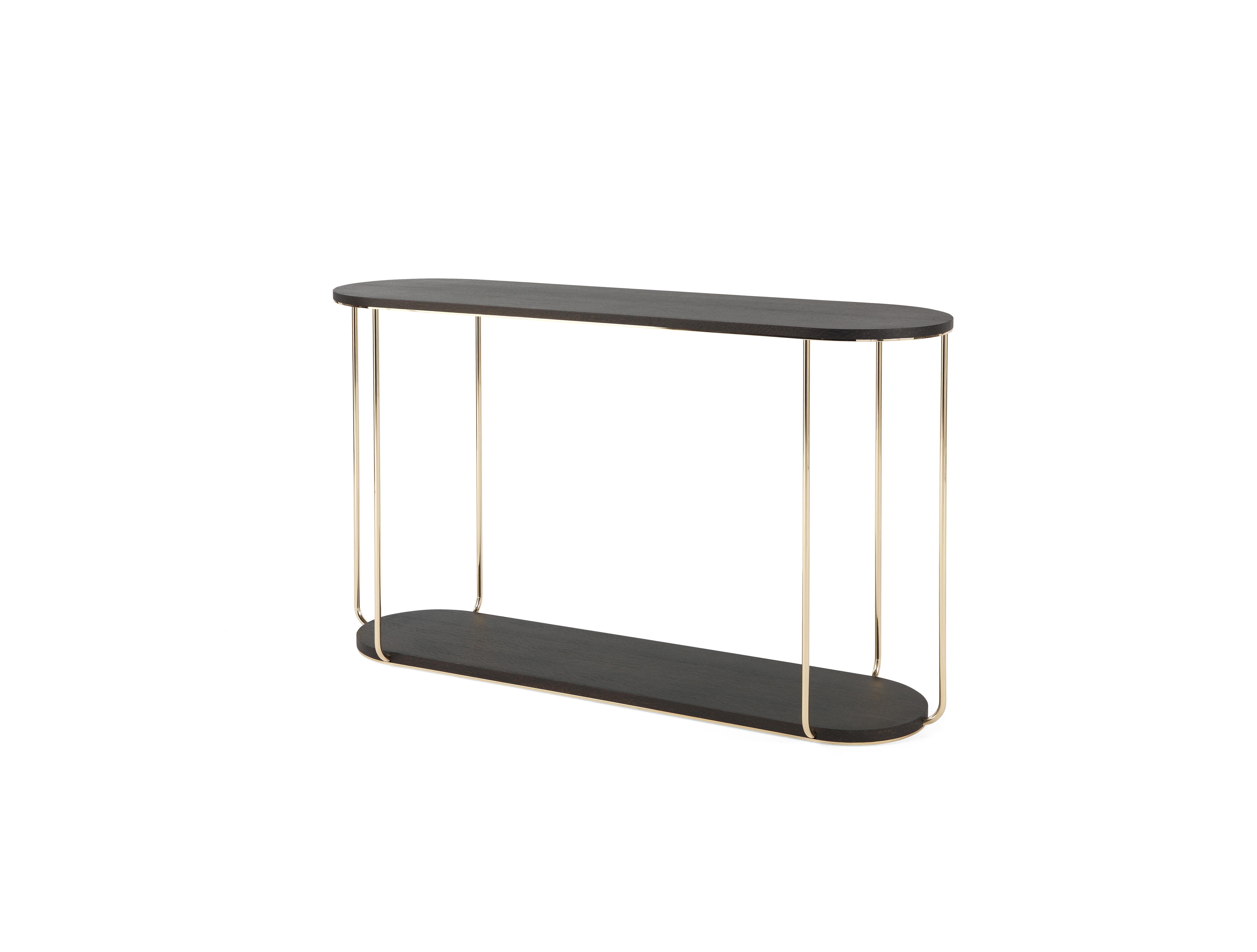 Ethnic accents and African references for the Ambar console, whose structure consists of a base and top in precious Carbalho wood evoke the typical African percussion. The thin structure in polished brass contrasts with the materiality of the wood
