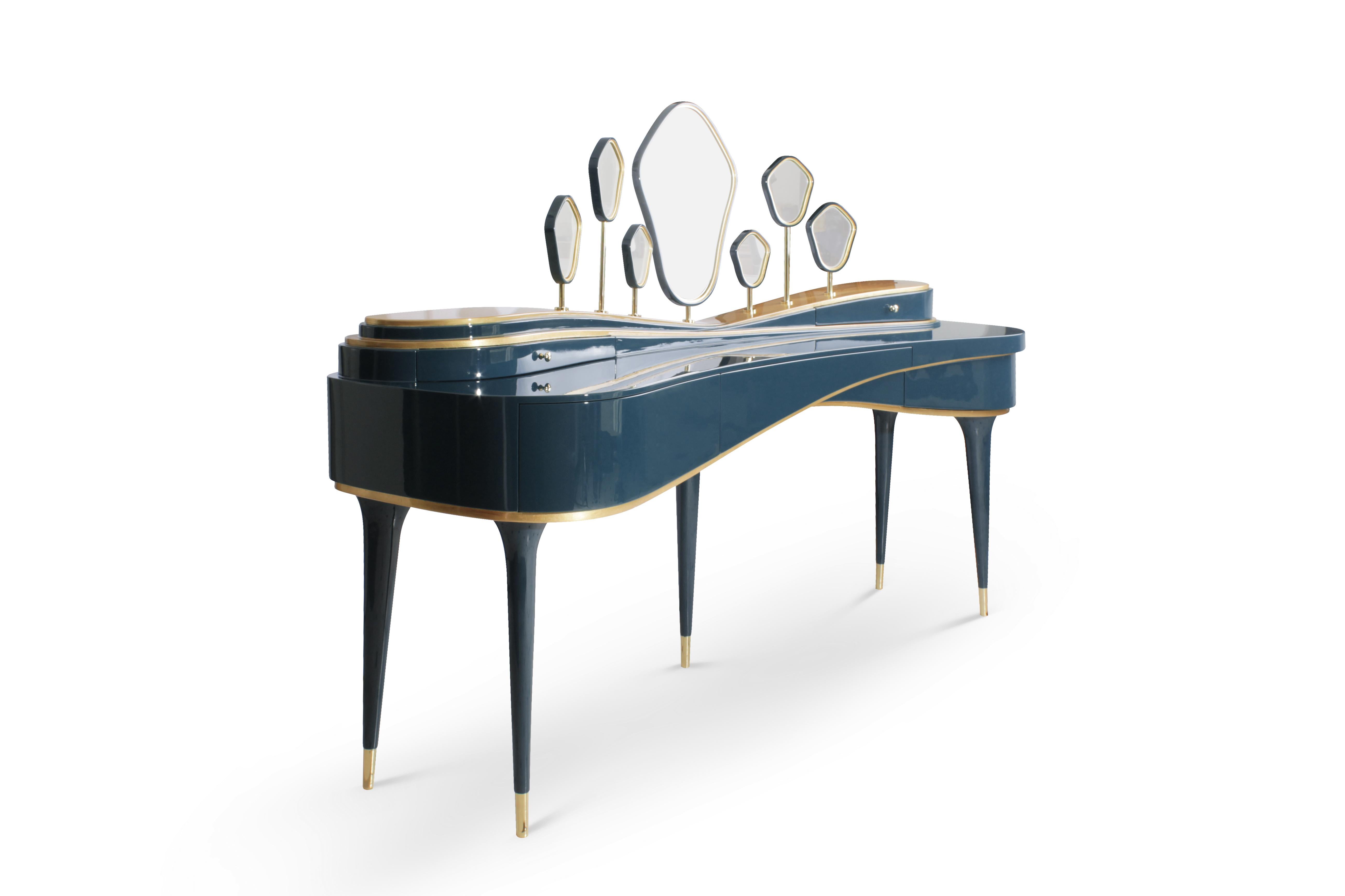 The Amélie dressing table is an expression of mysticism and magic. Inspired by the Pantone Colors of 2017, it presents a blue Niagara lacquered adorned by a brass structure and golden leaf accents. This chabi-chic dressing table is a masterpiece