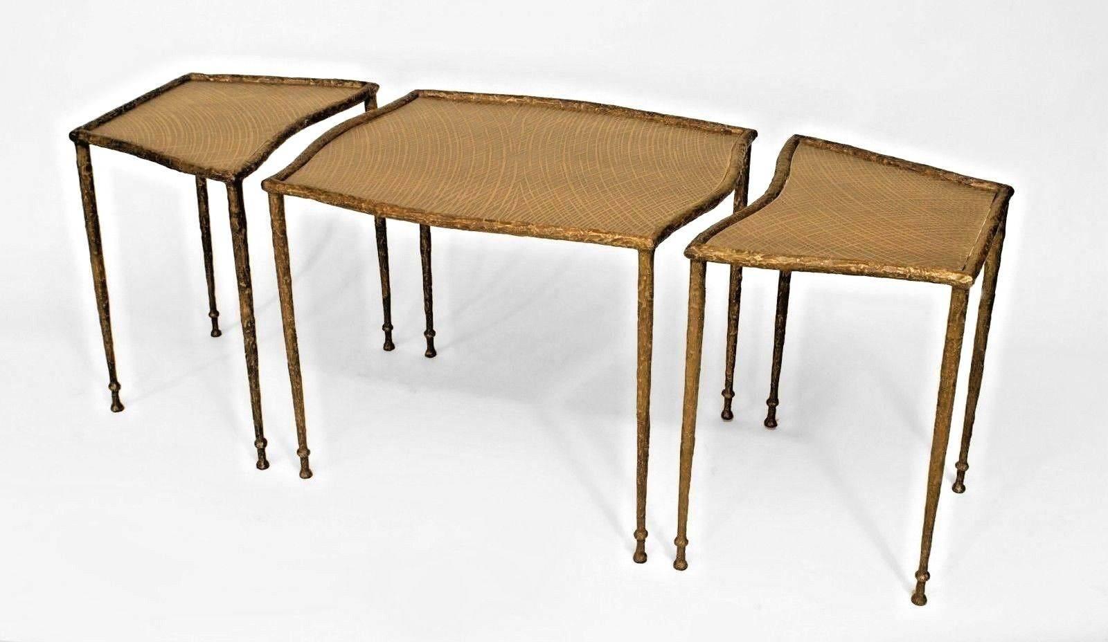 Patinated bronze three-section coffee table with four bronze legs on each section with hand detailed bronze tops.
