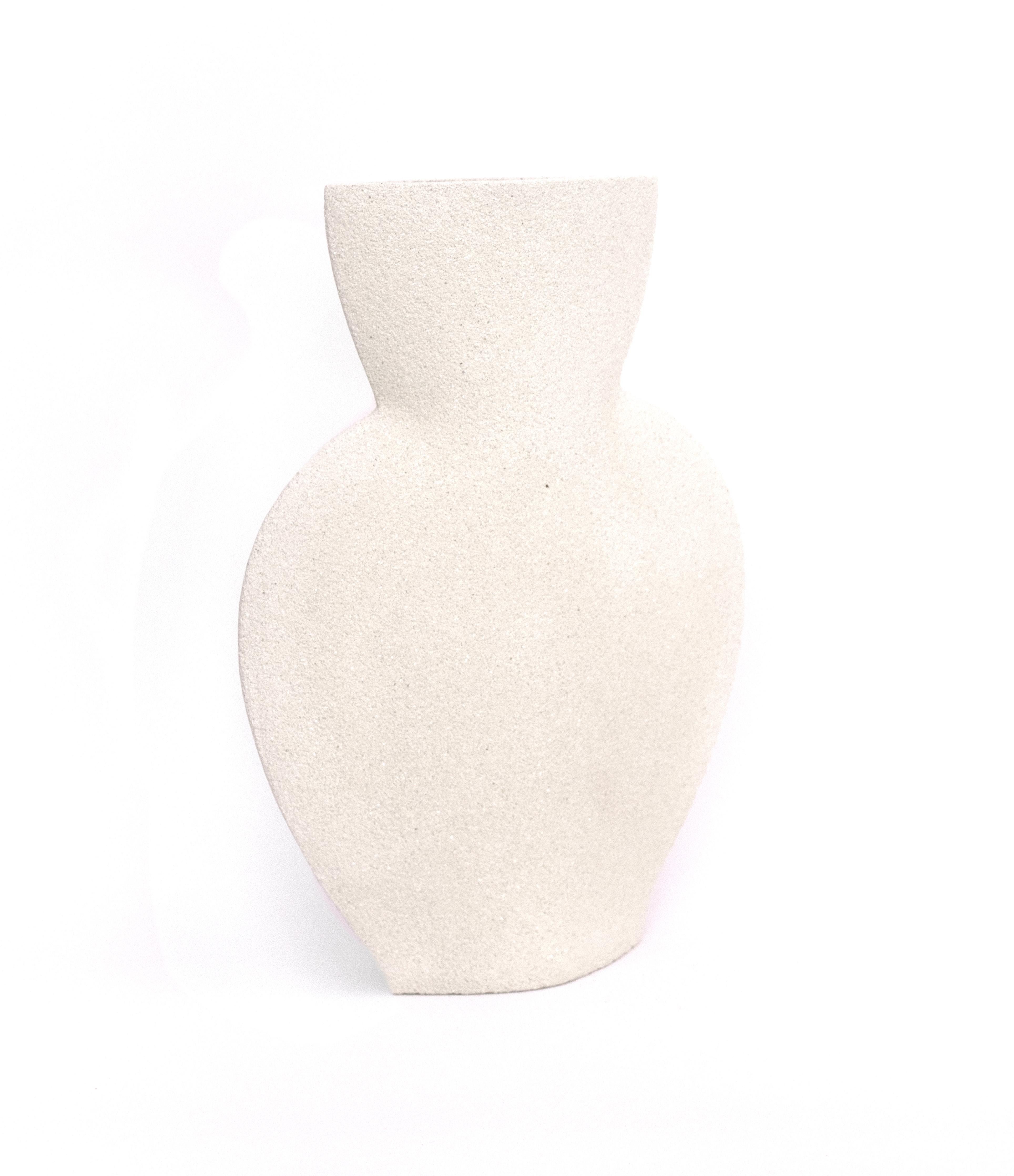 Amphora - white

Measures: 
H: 25 cm / L: 19 cm
H: 10 inch. / L: 7.5 inch.

- Stoneware fired at high temperature finished with transparent glossy glaze inside.
- Raw exterior showcasing the natural aspect of the clay’s texture.
- Hand-made