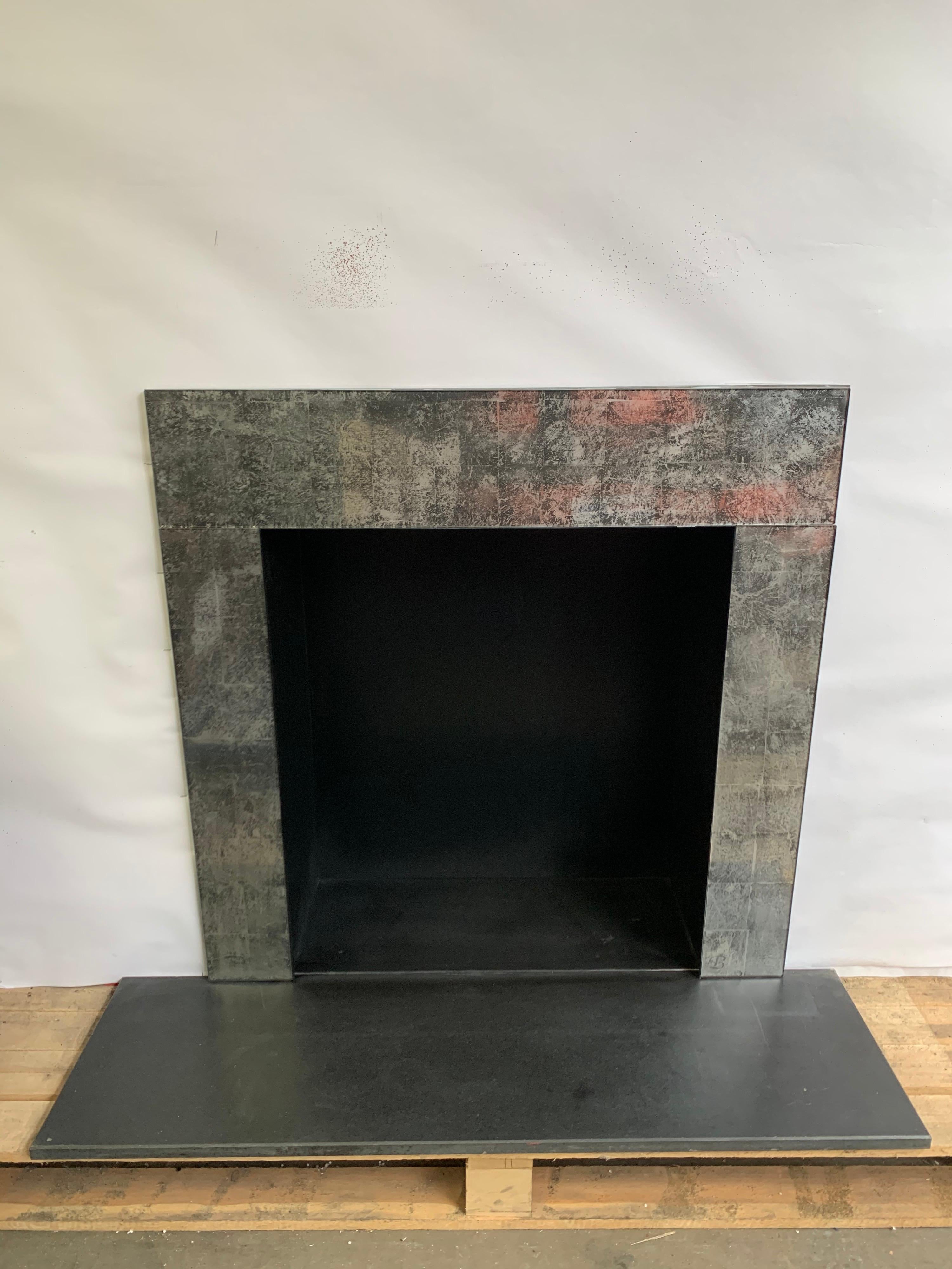 21st century antique glass & steel fireplace insert 
Hand made antique glass slips frame with black steel back box chamber.
Suitable for, gas fire, bio-ethanol fire or decorative purpose.
Unique one of a kind

Measures: Outside frame width 40