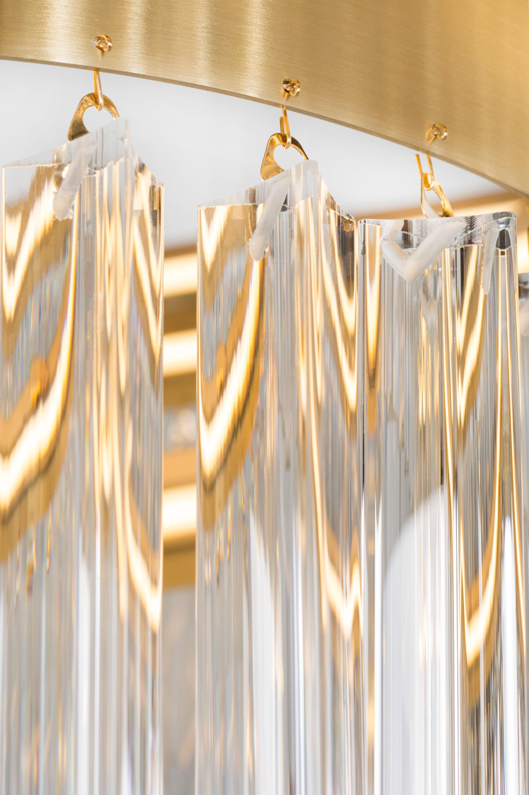 Erebus chandelier, Modern Collection, Handcrafted in Portugal - Europe by GF Modern.

The combination of brushed brass details with handcrafted crystal pendants creates a stylish, lustrous vibration. A new interpretation of chandelier design with