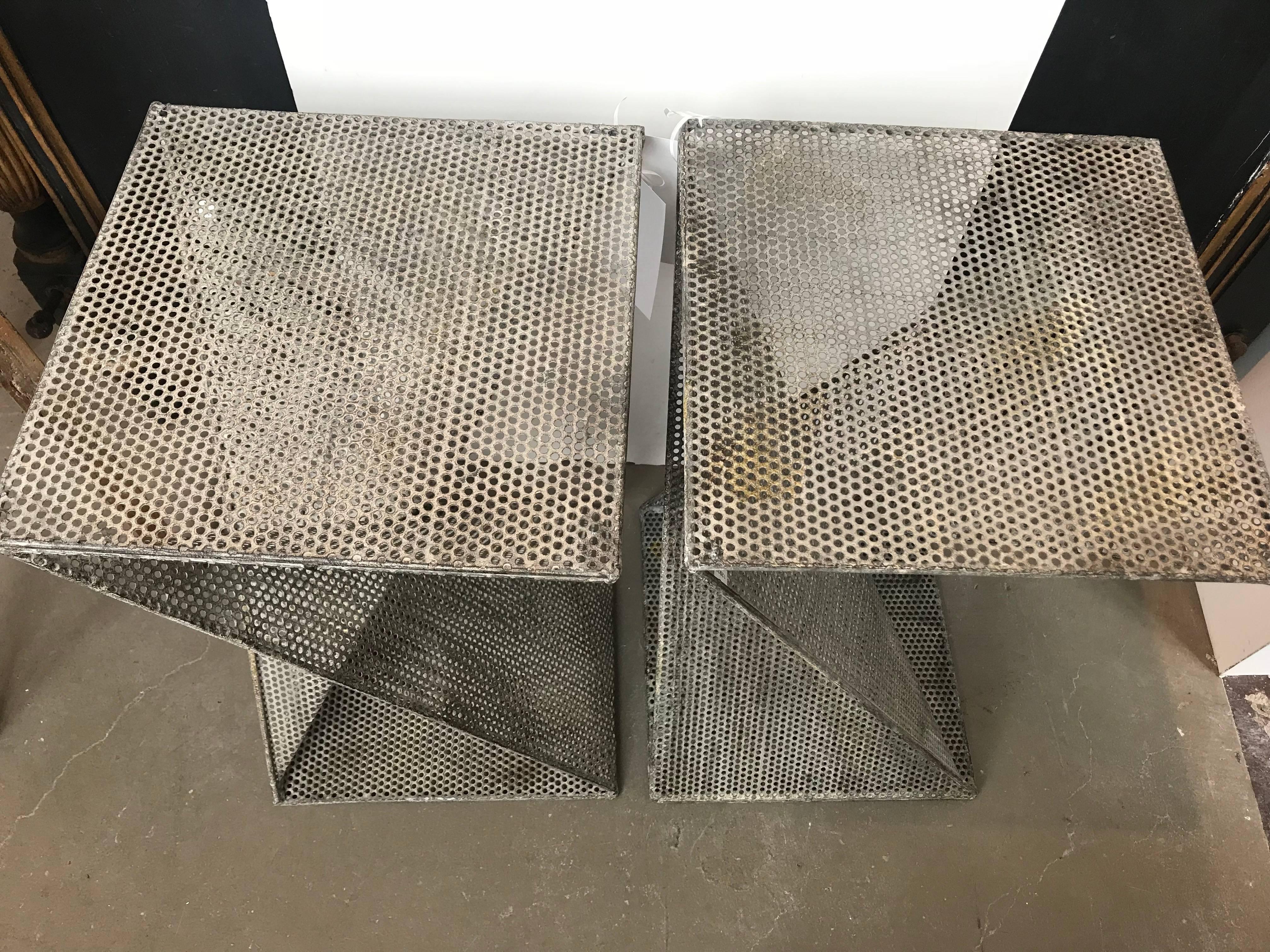 Uniquely shaped tables of perforated metal. Priced and sold separately, two available.