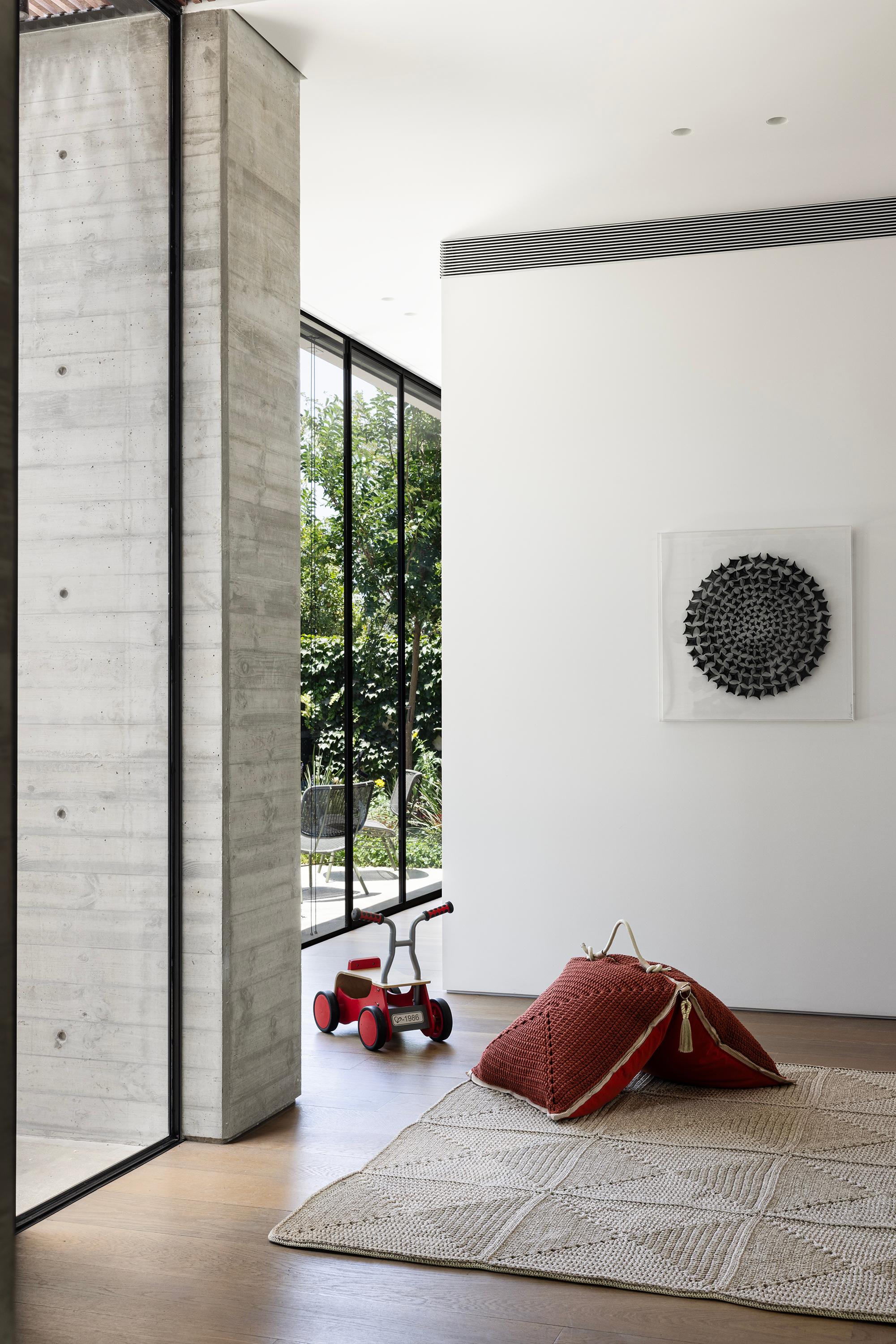 The Classic crochet granny square takes a contemporary twist in this outdoor rug. Large squares form the rug, framed with bespoke webbing. Handmade from UV protected bespoke iota yarn in earth tones, the textile is soft, yet durable and suitable for