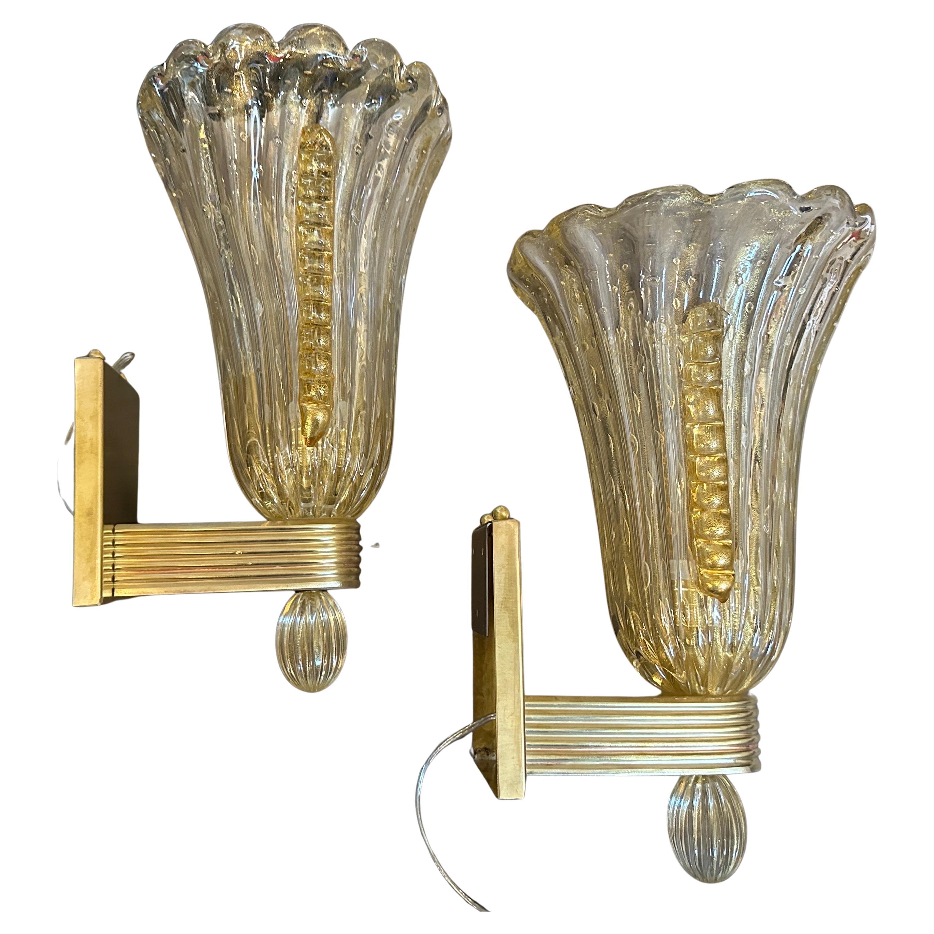 These 21st Century Barovier-Style Modern Amber Bullicante Murano Glass and Brass Wall Sconces are stunning examples of contemporary Murano glass craftsmanship, inspired by the historic Barovier & Toso designs.
Bullicante Hand-blown Amber Murano