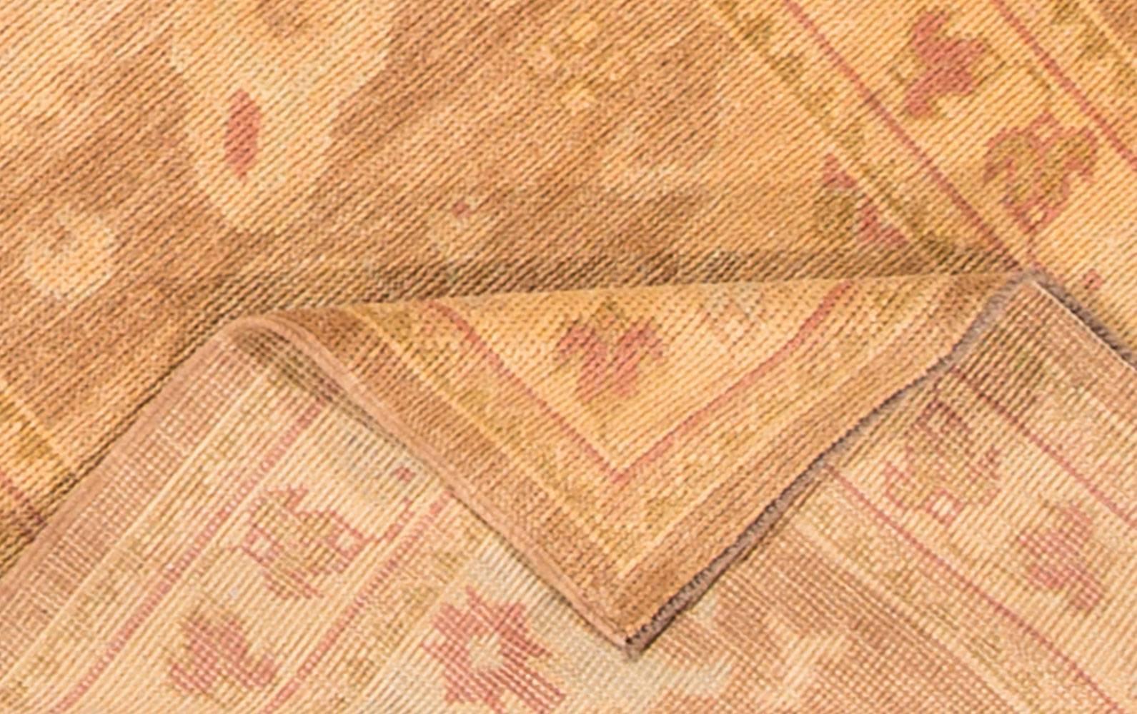 21st century Turkish Oushak runner rug. This piece features a thin double border, peachy-beige field, and traditional all-over design in lighter earth tones. Measures 3x10.02.