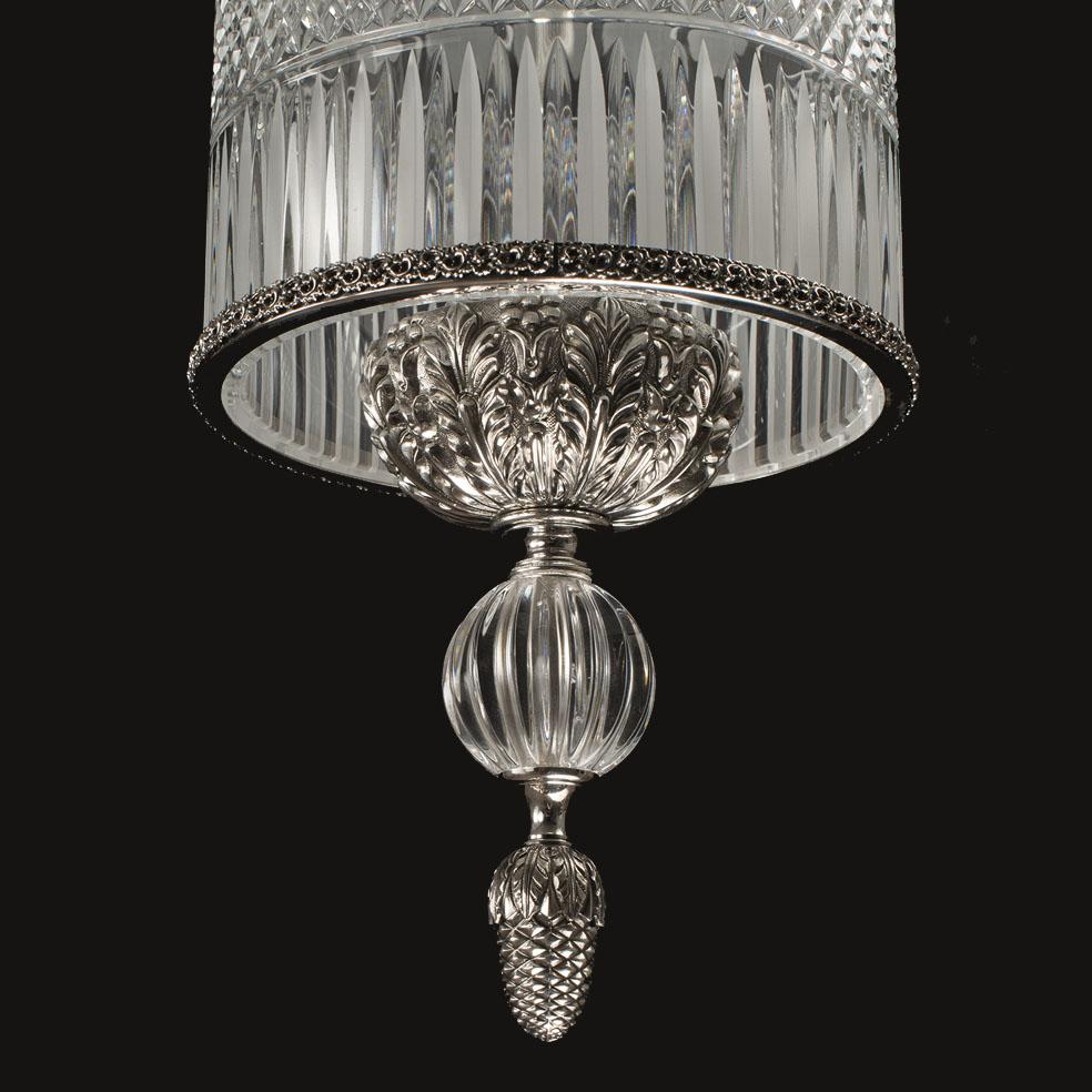 Lantern with Leds in hand-carved clear crystal and patinated silver bronze. This particular lantern is illuminated by LEDs. Each object is handcrafted and the care for every detail makes each item unique in its kind. The style of this chandelier is