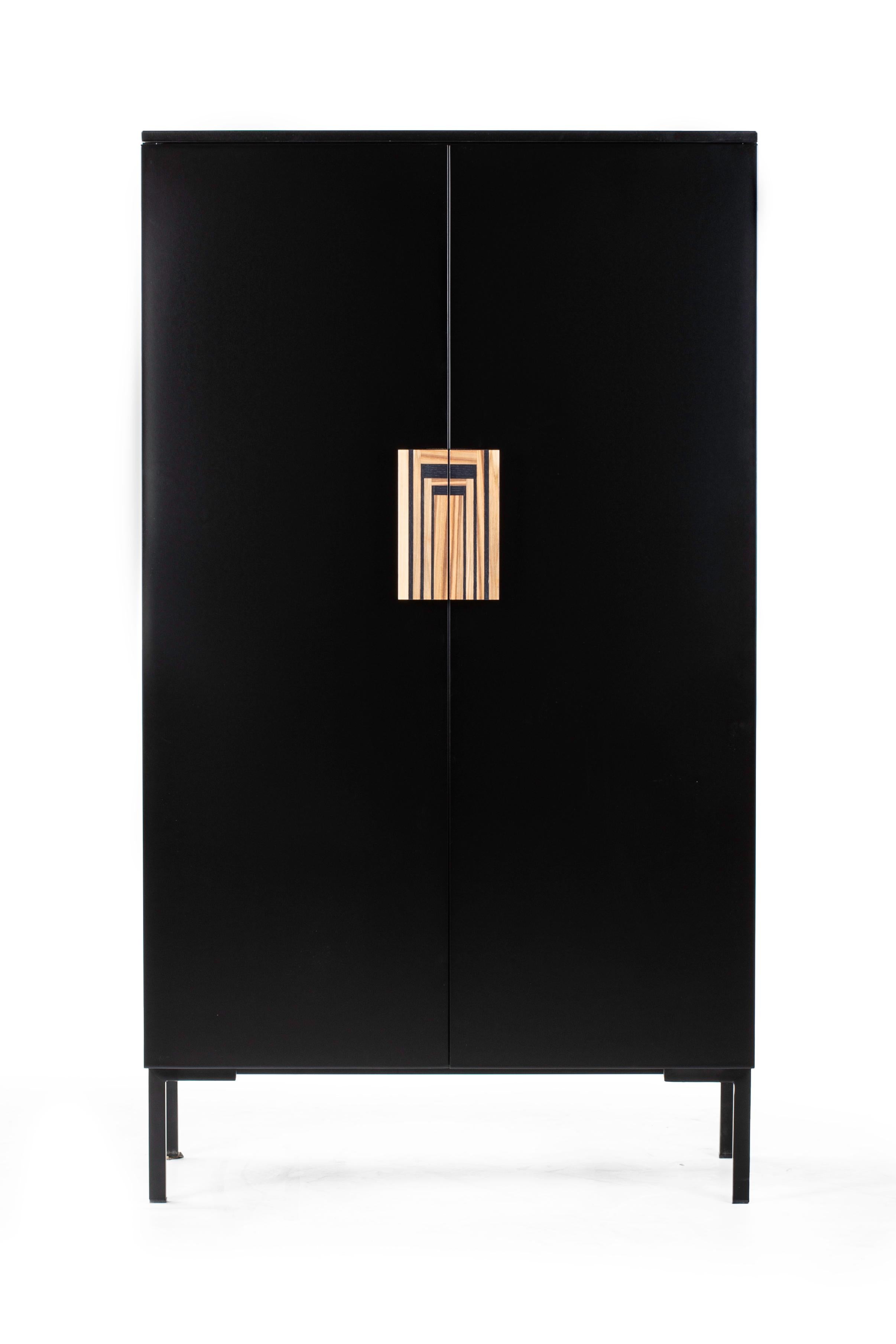 A splendid and elegant design that will imbue a refined contemporary interior with utmost sophistication, this cabinet will elevate the style of an entryway decor. Superbly handcrafted of black-lacquered wood, it features hand-inlaid handles made of