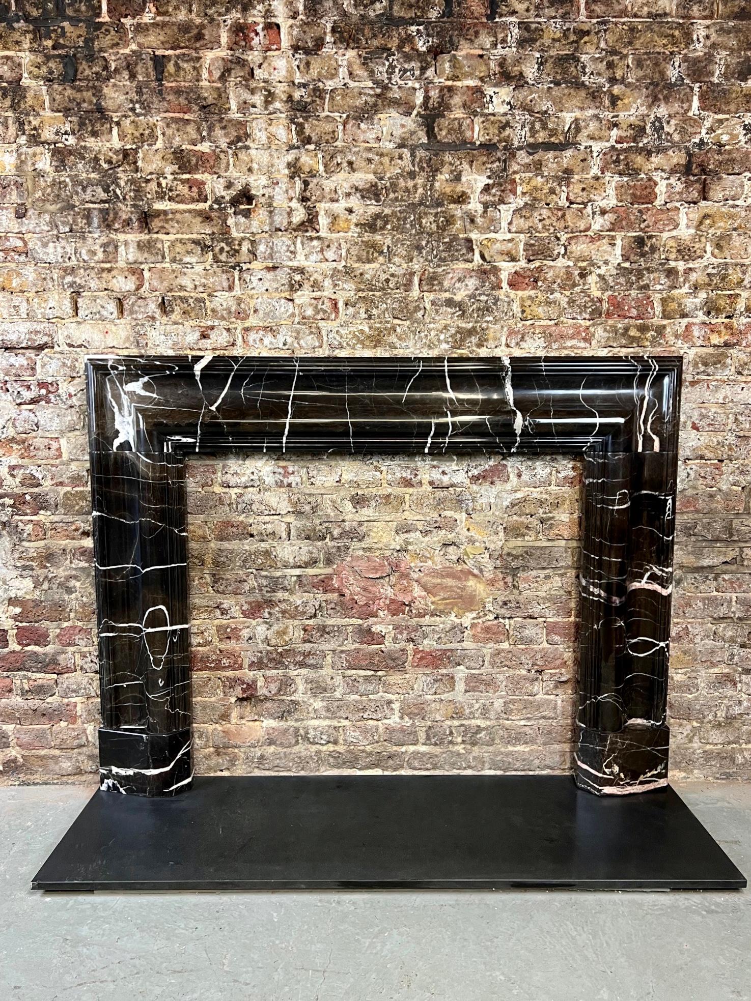 21st Century Bolection Marble Fireplace Surround.
This English Made Luxury Marble Fireplace Mantlepiece Is Hand Carved From A Golden Jade Brown Marble With A Bolection Mouding.
It Has Been Lightly Polished In Order To Fully Appreciate The Beauty Of