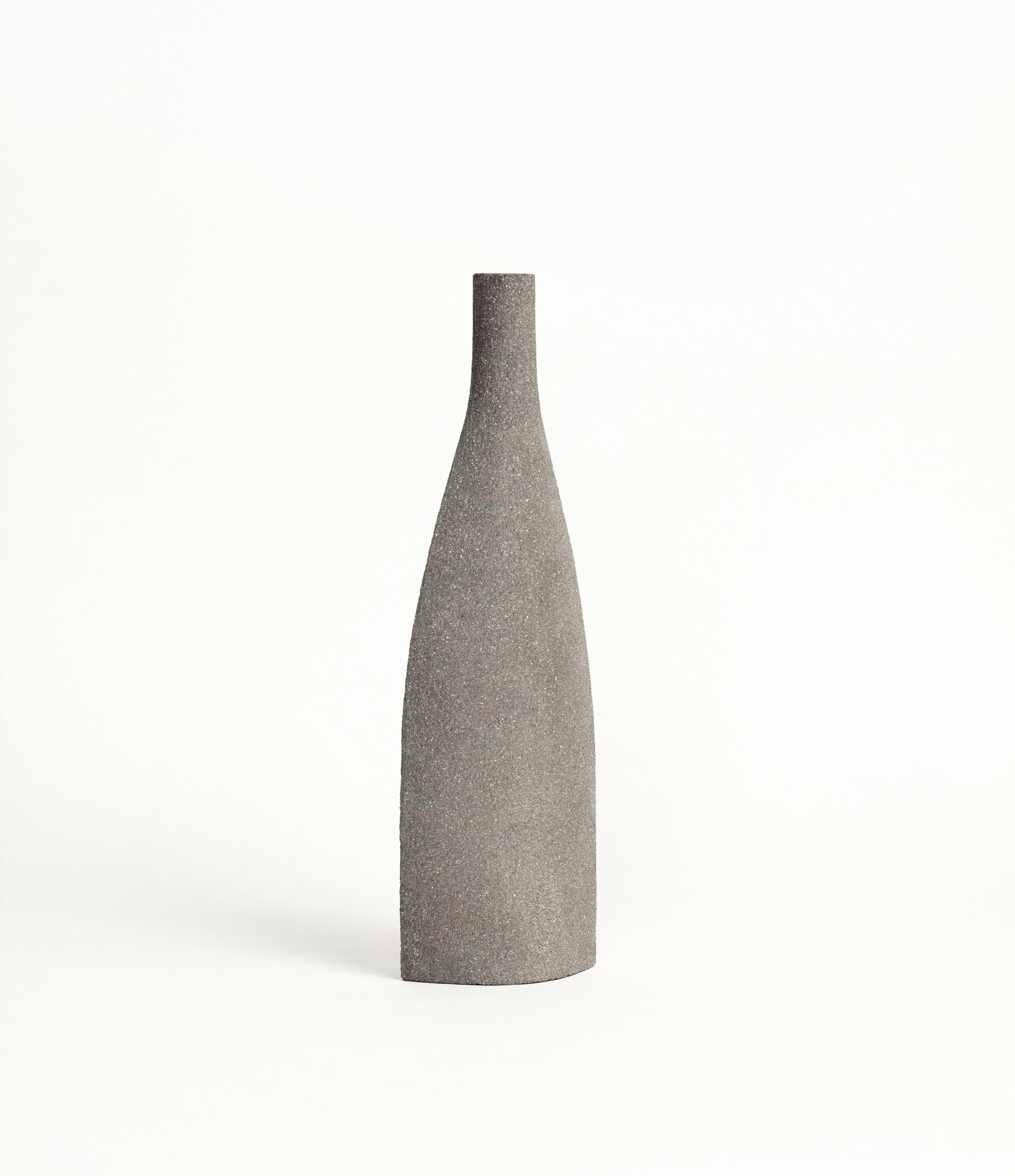 Bouteille [M] - Grey

Hand-crafted in our studio in France.

Measures: H: 28 CM / L: 10 CM
H: 11 inch / L: 4 inch.

- Stoneware fired at high temperature finished with transparent glossy glaze inside.
- Raw exterior showcasing the natural