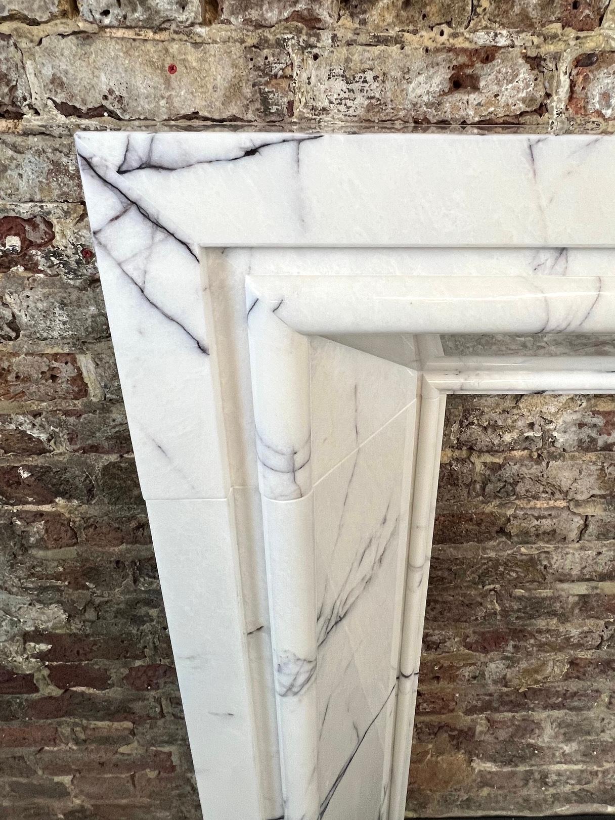 21st Century Breccia Marble Fireplace Surround.
This Contemporary Fireplace Mantlepiece Design Is Actually Based On A Traditional 
Georgian Design. It Has Been Hand Carved From Selected Italian Lilac Viola Marble.
Each Fireplace Made In This