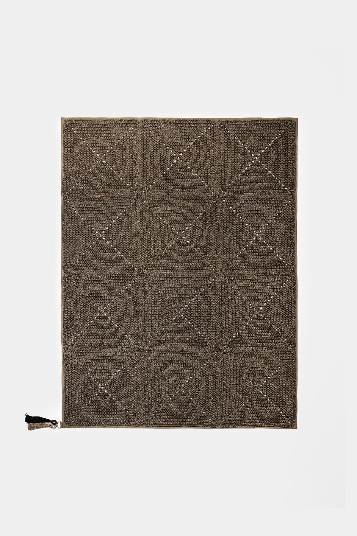 21st century brown black outdoor indoor rug, bag cushion, and double cushion crochet UV protected yarn set.

The classic crochet granny square takes a contemporary twist in this outdoor set. This set explores the aesthetics of nomads and wants to