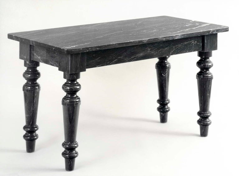 Marble table designed by Aldo Rossi.

Size: cm. 90 x 180 x 76 H.
Materials: Bianco Carrara / Nero Marquina / Bardiglio Imperiale
Designed by: Aldo Rossi.