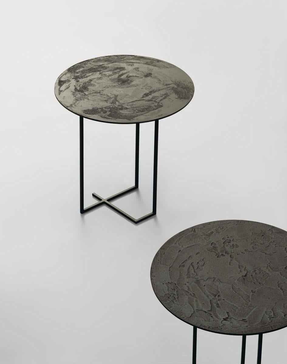 Indoor-outdoor coffee table, base realized in welded square drawn steel rod, top in steel with artisan finishes.
   