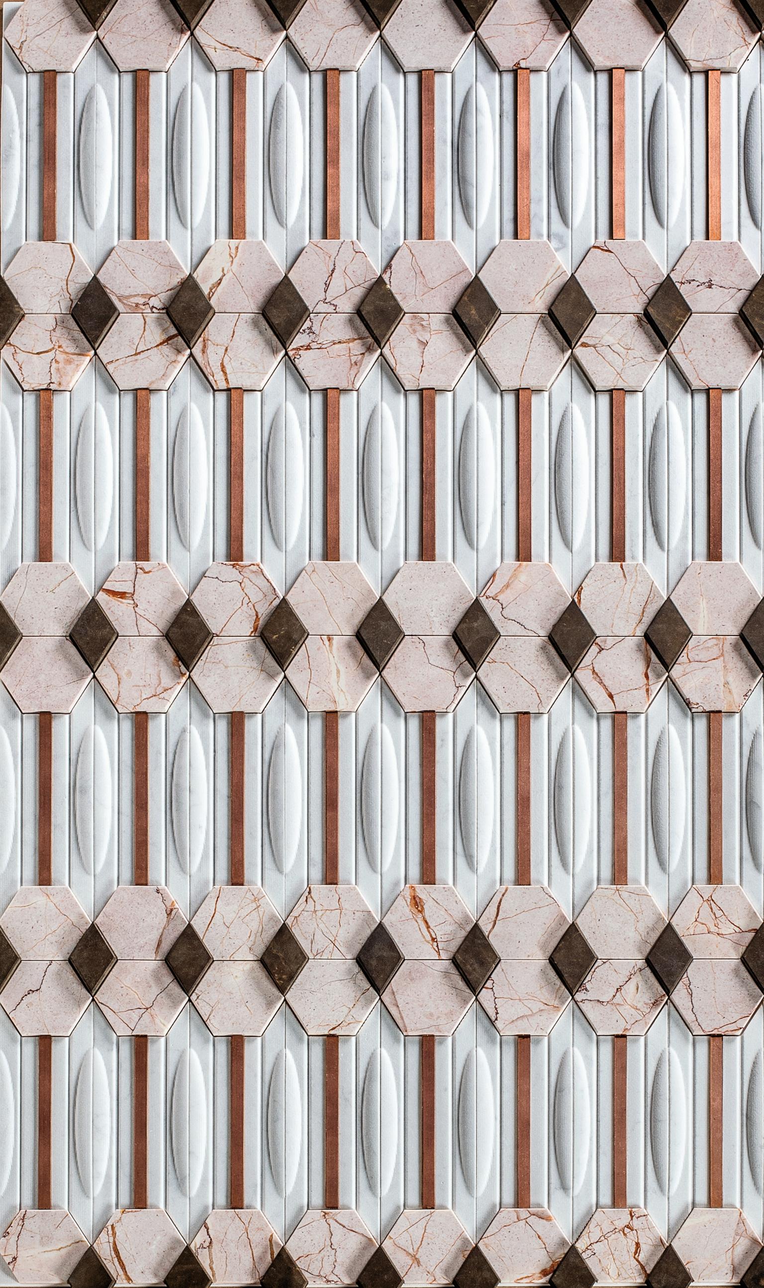 BYZAS 
Wall decor
Dimensions: Single tile 30 x 16 x 2 cm
Materials: Bas-relief in Bianco Carrara marble, hexagons in pink marble polished finish, rhombus in pietra pece honed finish and copper strip satin finish

   