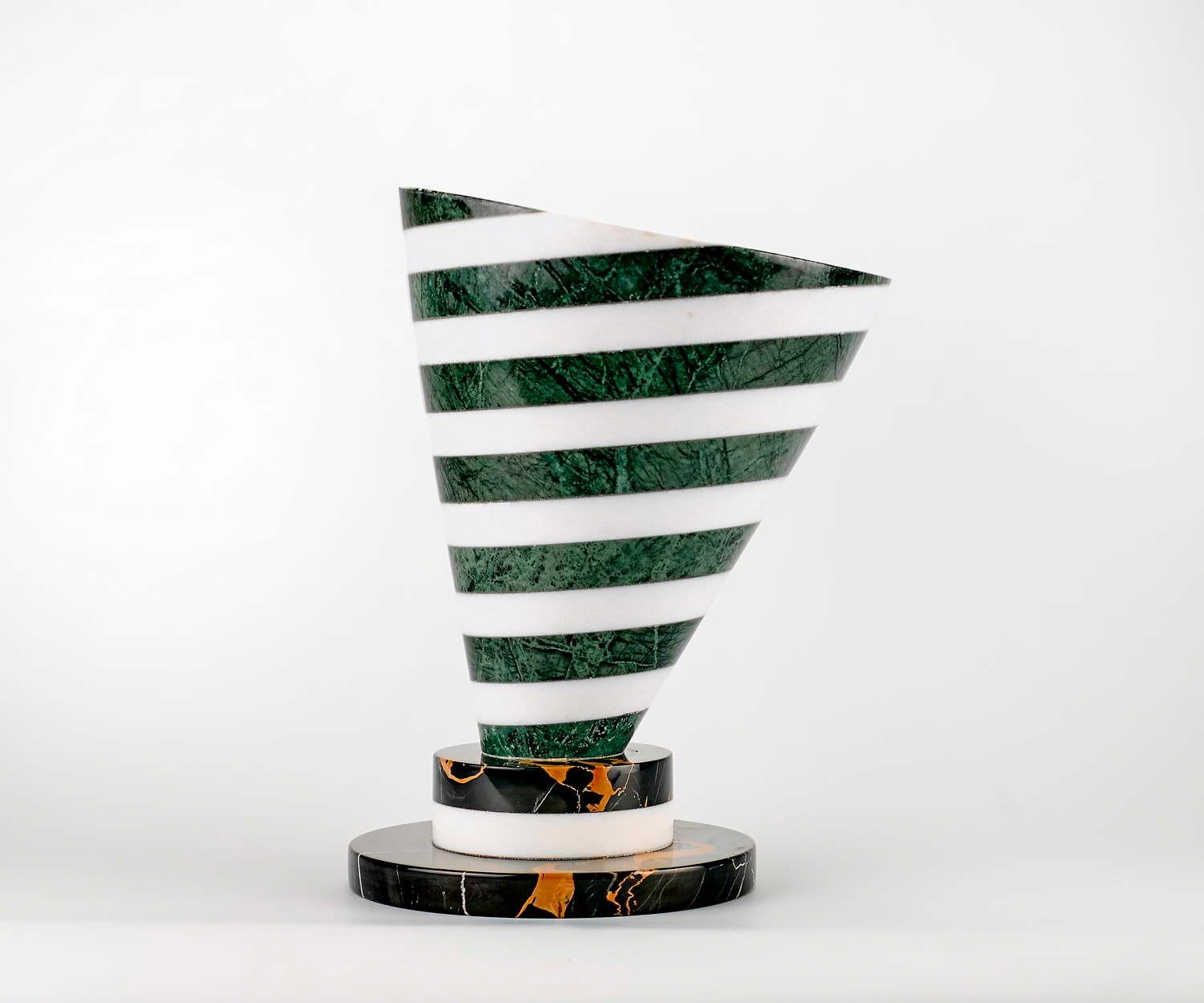 Marble vase designed by Martine Bedin

Size: Diameter cm 22 x height 30
Materials: Nero Marquina - Bianco Carrara - Verde Alpi
Designer: Martine Bedin.