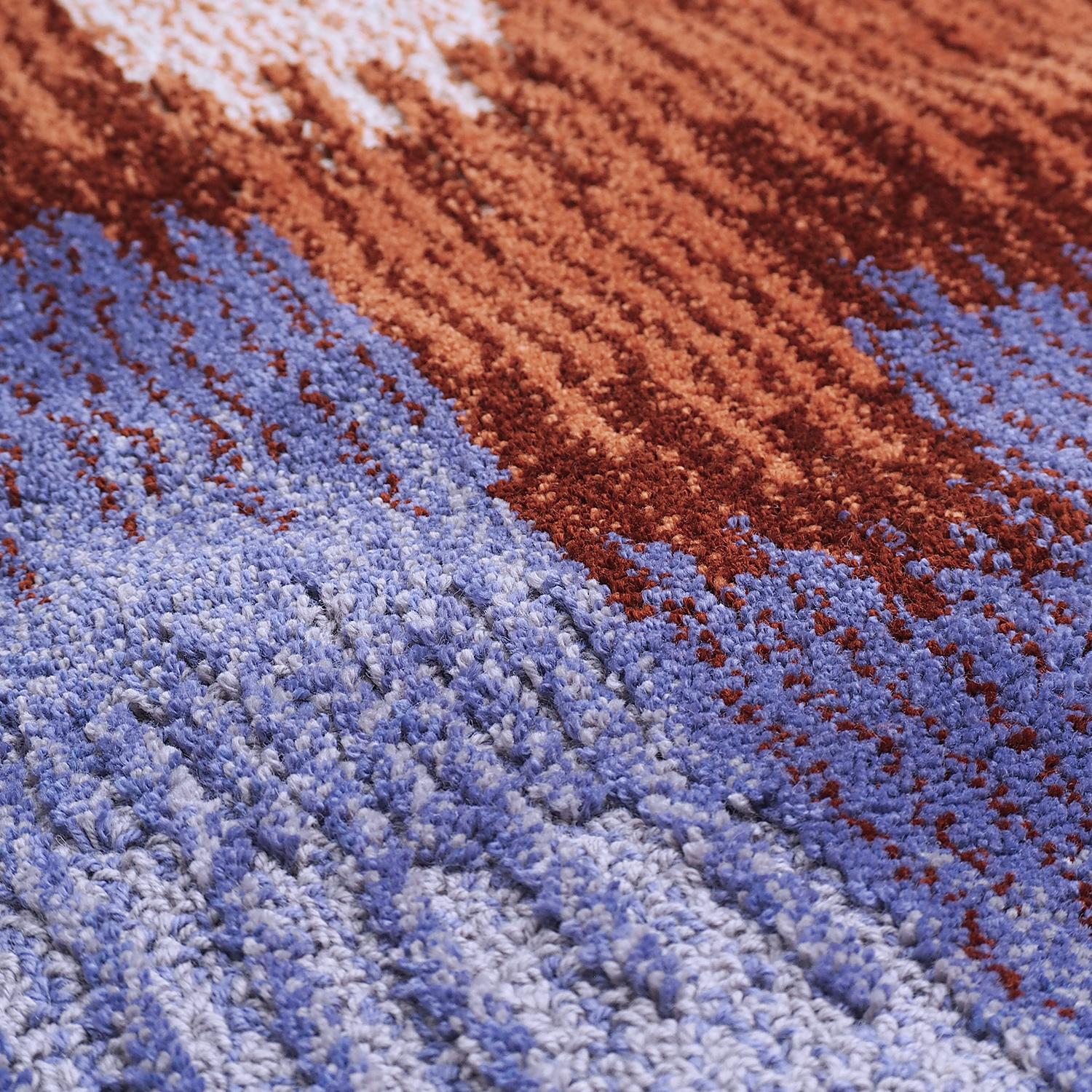Epoca is a 100% top quality New Zealand wool tafted rug.
Exclusively manufactured in Venice, Italy for Portego.

It have been use the loop and velvet technique with different lengths to create a deep perception.
In this version: royal blue and brick