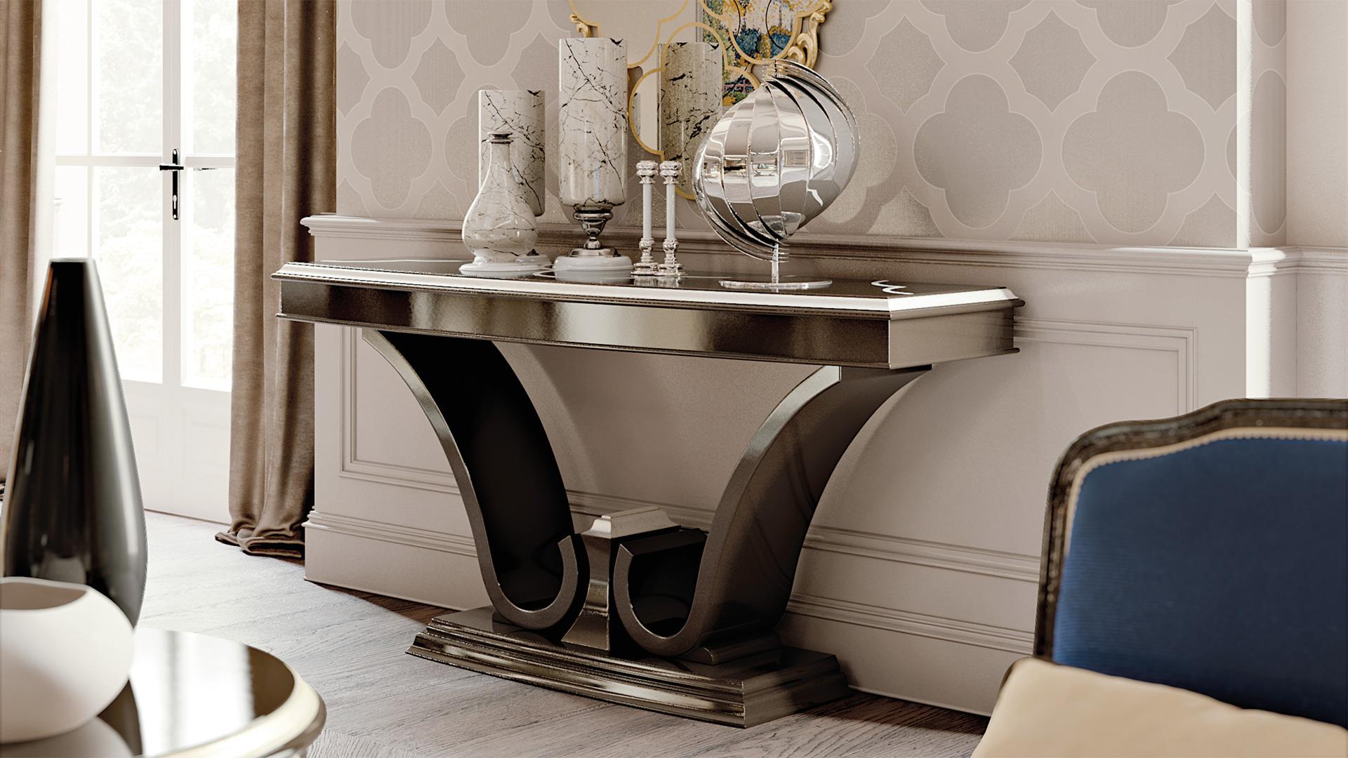 Console. The complexity of the base realized in wood with the curved sides makes this consolle truly a piece of art. On the top, a beautiful clover design in real Silver Leaf is applied creating a classic and luxury feeling. 
The finishing is cod.