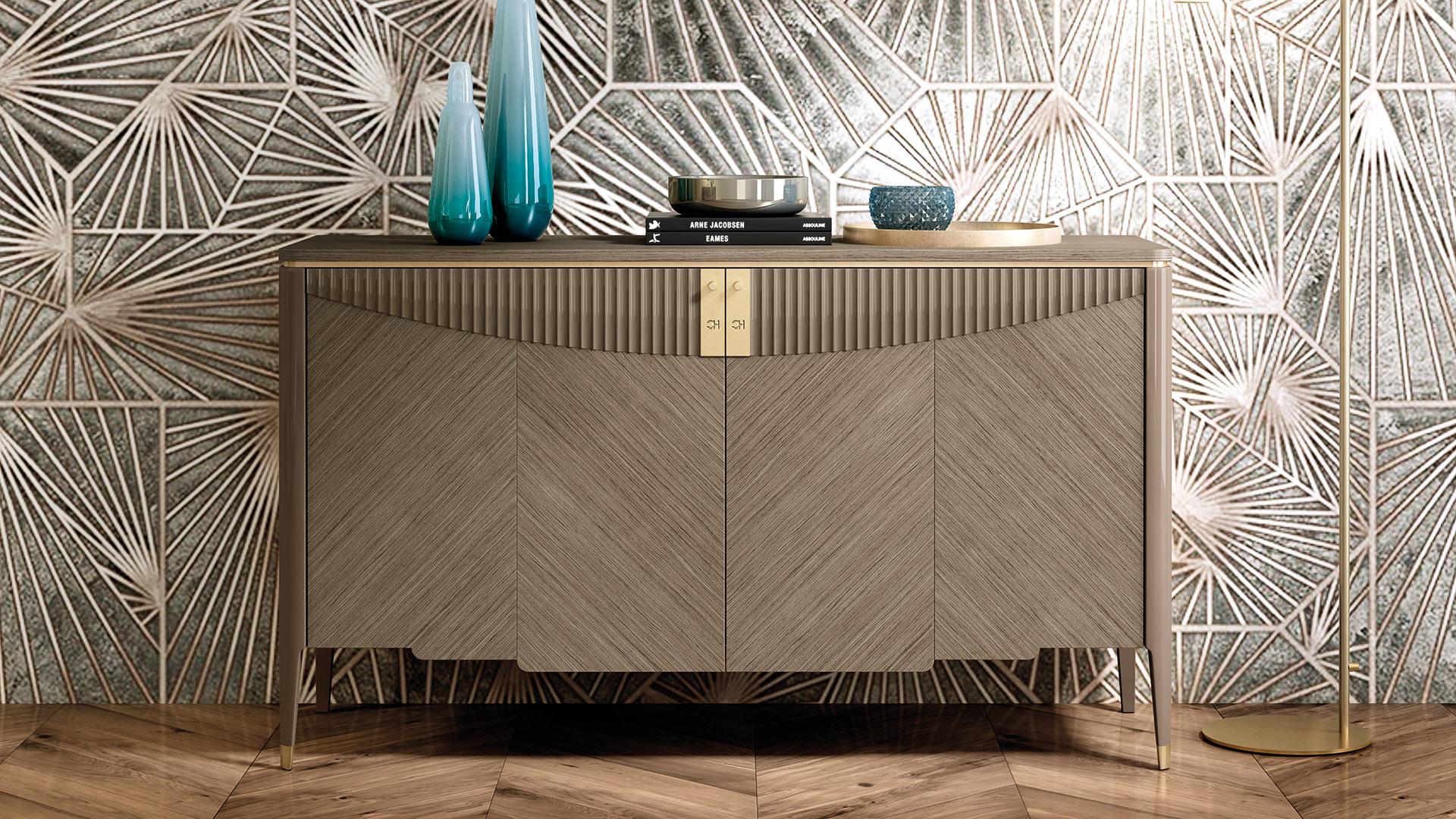 Two door sideboard. The beautiful mix between natural Walnut wood and golden galvanic metal details is perfect for a Contemporary and luxurious environment . The lacquered wave decor on the front gives a touch of style to the piece. On the inside,