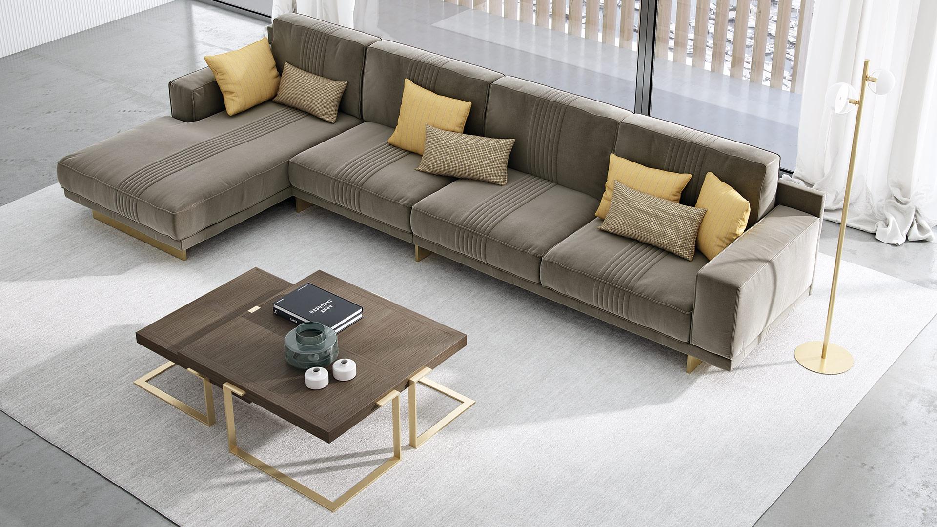 Modular sofa characterized by a soft backrest perfectly shaped that enhances the comfort.
The metal base is in gold finishing and improves the modern look of the sofa.
On the back and on the seating complete the design thanks to pipeline