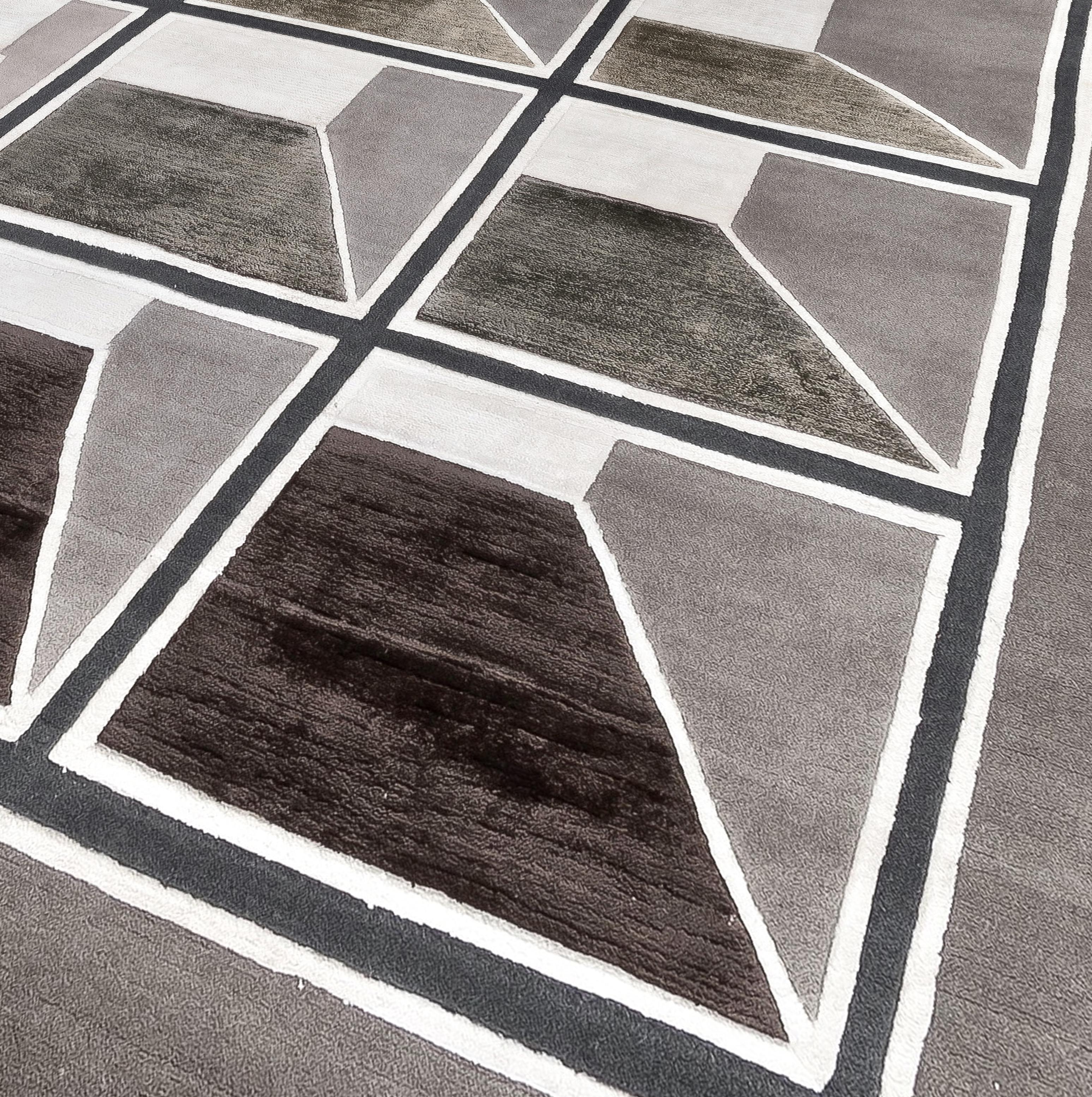 A geometric and concentric structure where it's not clear whether the point of view is from up to down or viceversa.
This rug is hand knotted in Nepal by our artisans by using 50% silk and 50% fine Himalayan wool dyed using vegetable and mineral