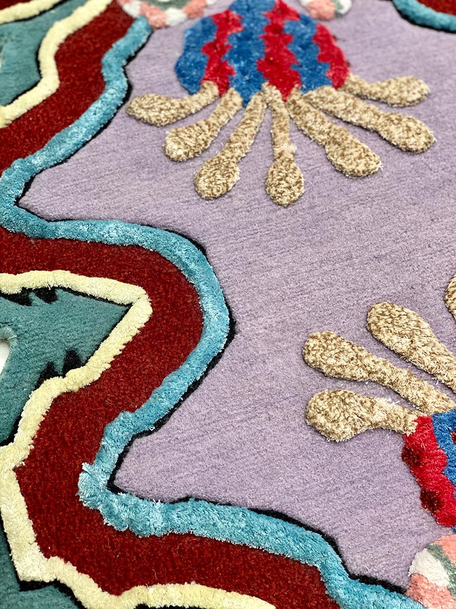 It’s a playful hand-knotted rug made with Himalayan wool and natural silk, inspired by flora and organic shapes with vibrant colors and stylistic geometries that reflect artist’s eclectic vision and her personal take on interior design.

This rug