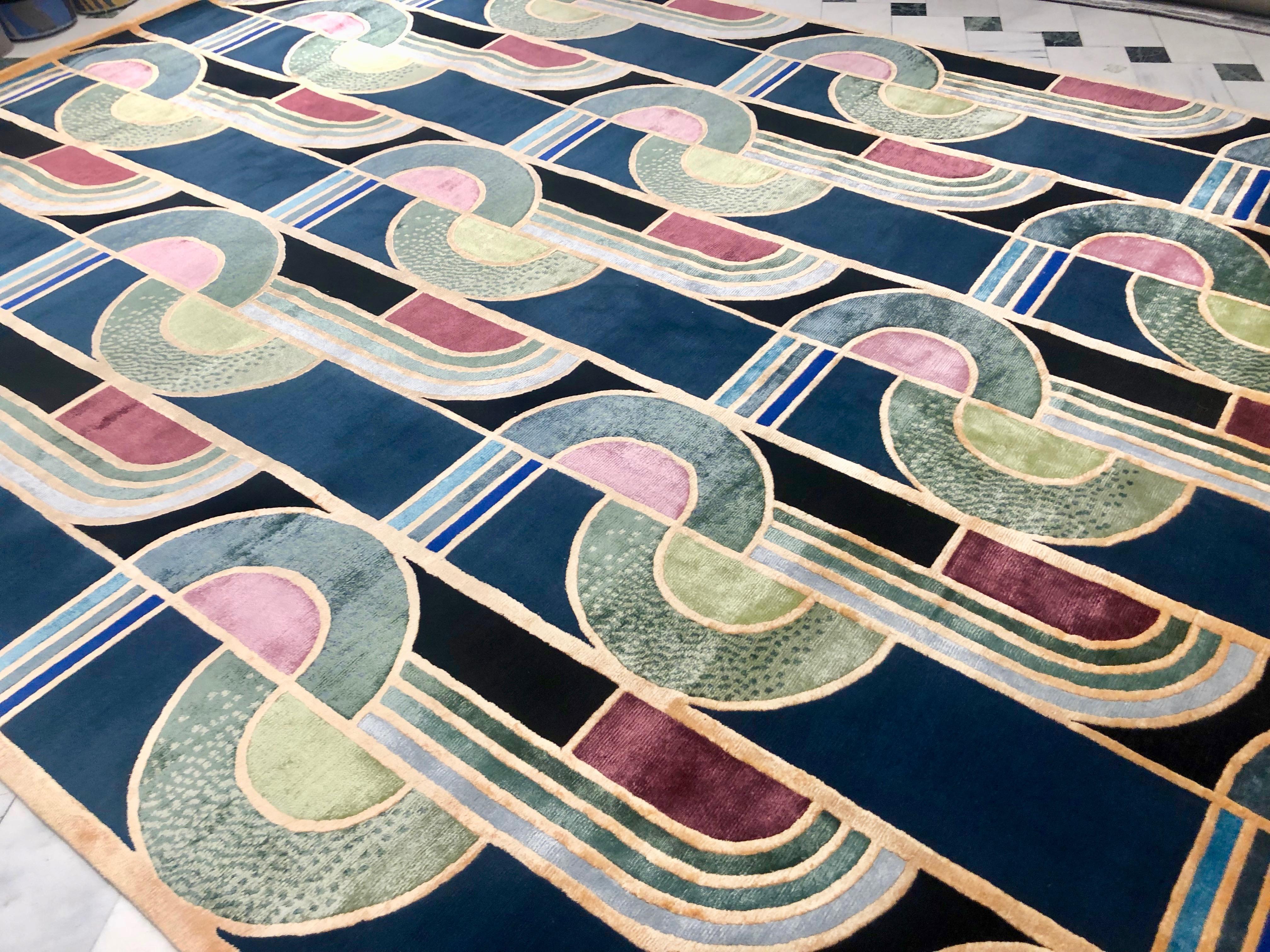 Hand knotted in Nepal by master craftsmen, this rug is part of the Limited Edition collection and designed by Emtivi studio. It boasts a sophisticated combination of curves and lines in vibrant hues obtained with vegetable and mineral dyes and a