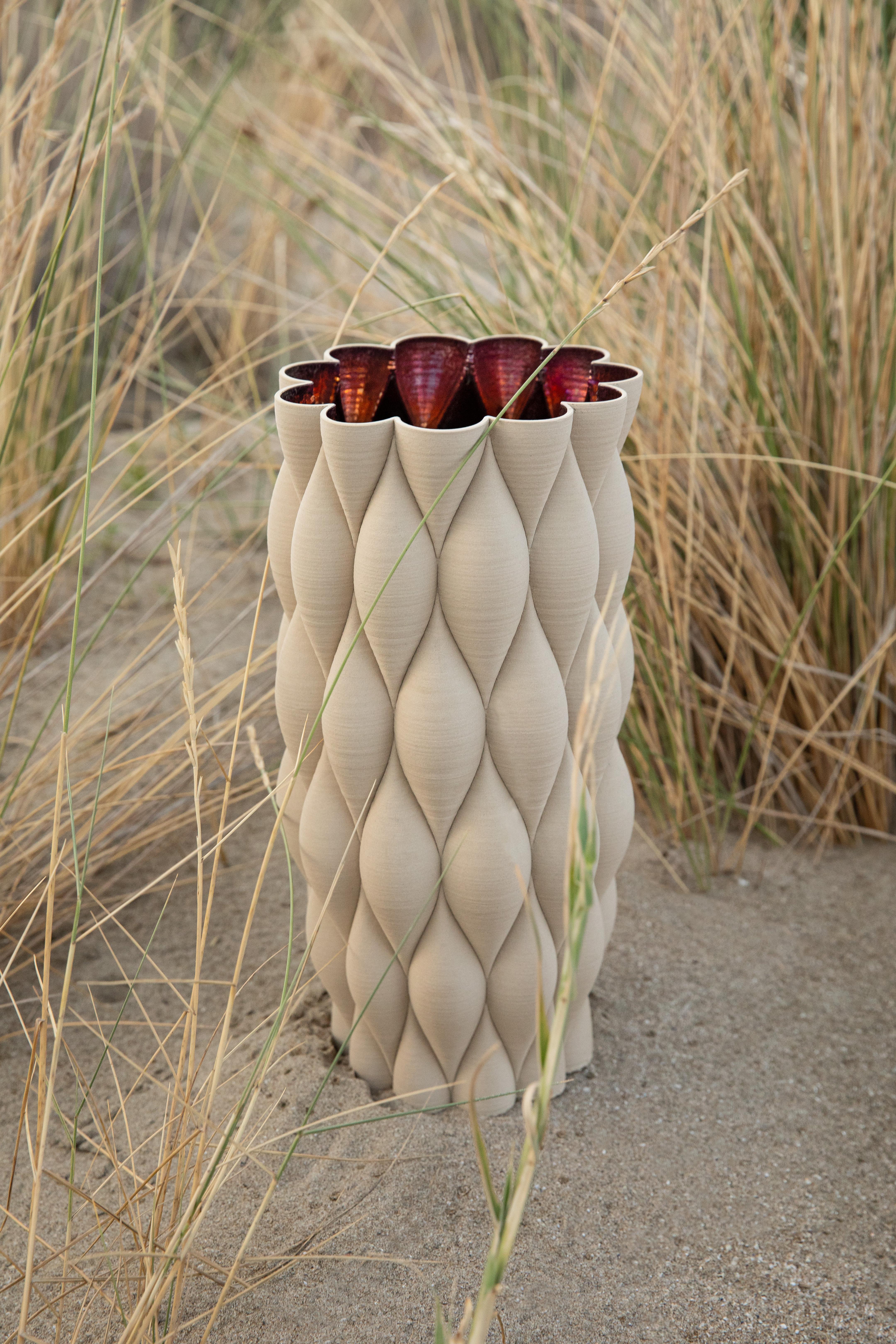 The New Delhi is part of the Mitti Vases collection, presented at the Milan Design Week Fuorisalone 2021 edition and created after a long trip to India. 
The collection explores different palettes and surfaces, using unfinished stoneware that feels