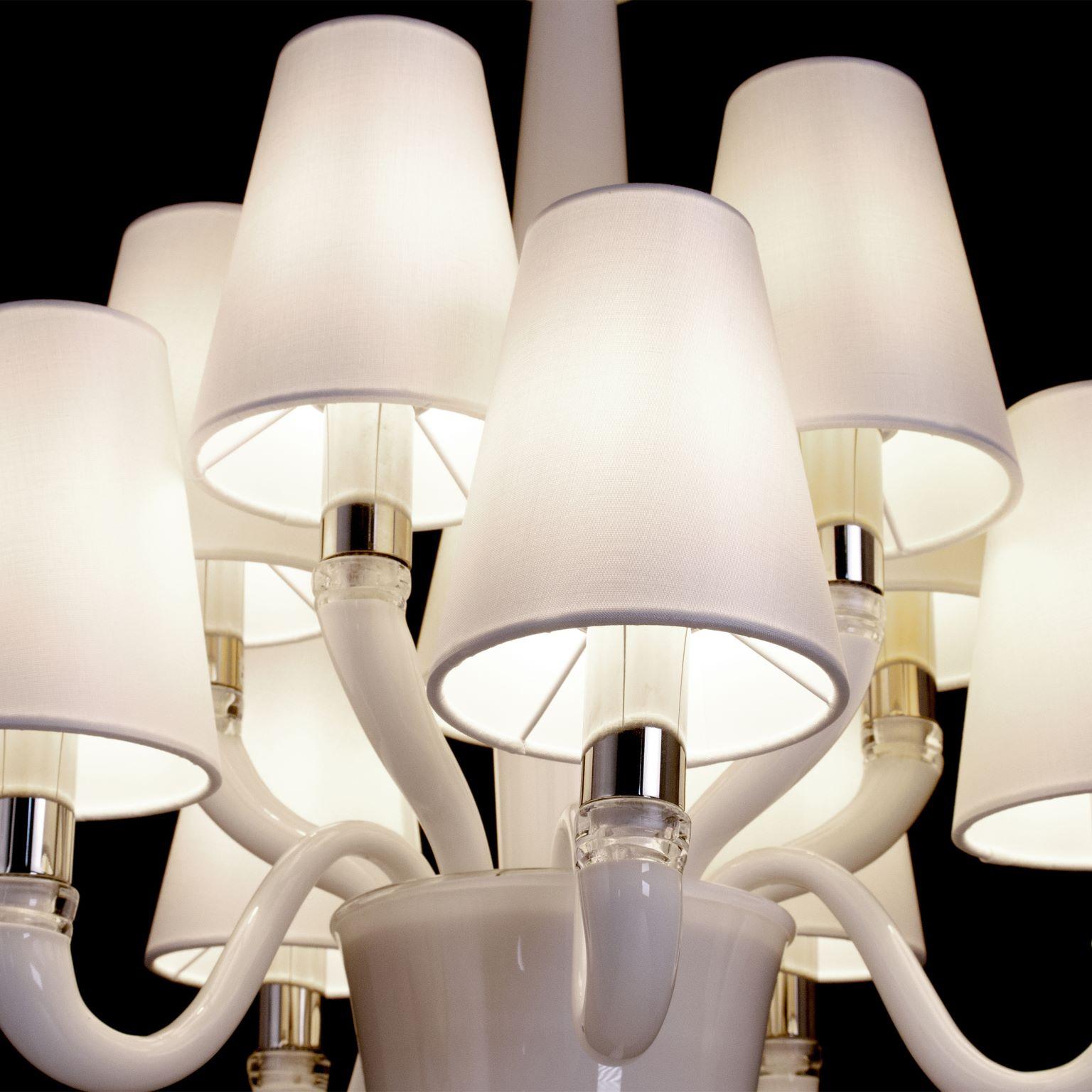 Chandelier Dandy 5+5 lights. white Murano glass. white lampshades by Multiforme. 

Dandy is a lighting collection made of encased Murano glass and finished with simple lampshades. The Dandy glass chandeliers are inspired by simple volumes, and are