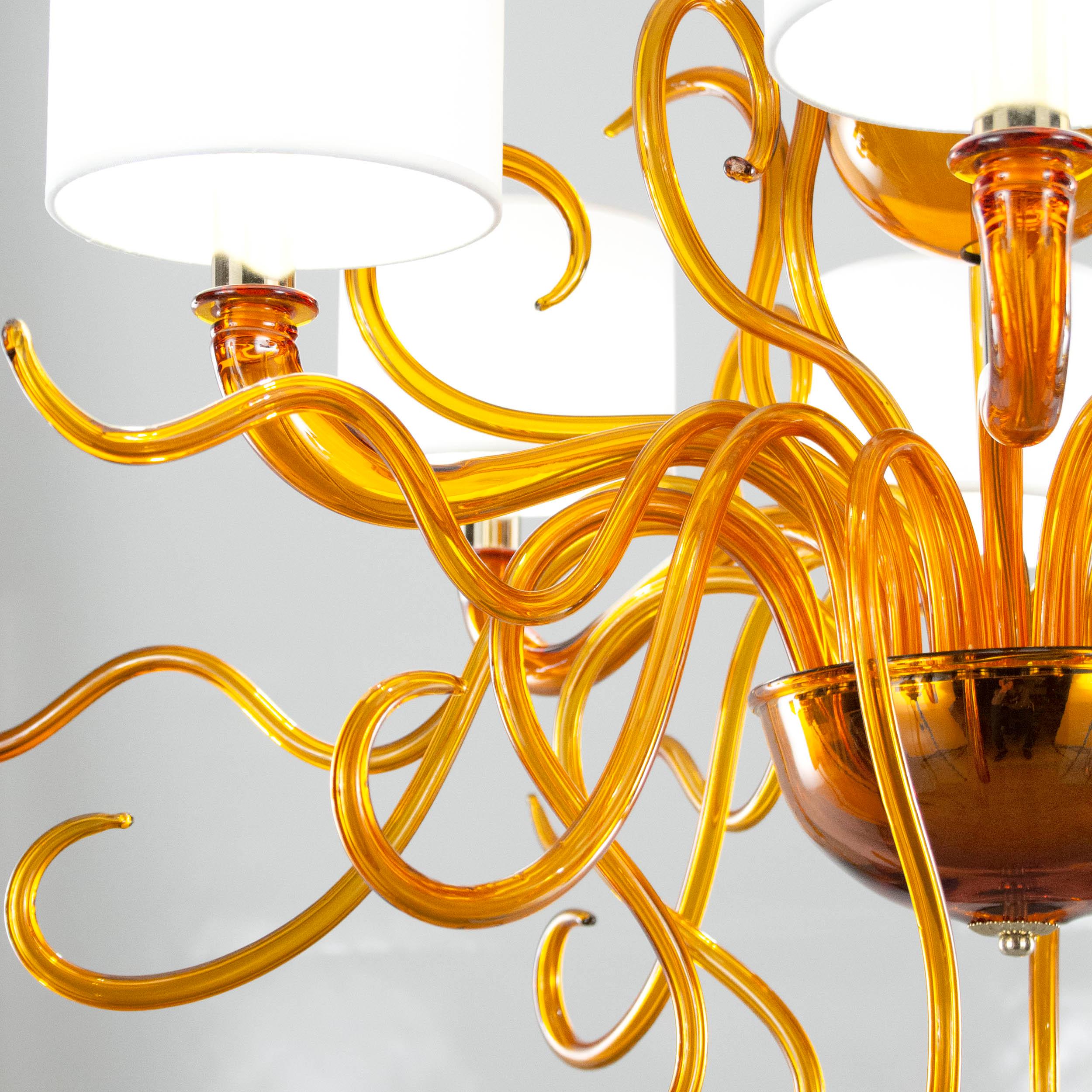 Tourbillon chandelier with 6 lights. Amber Murano glass. White cotton lampshades by Multiforme

The contemporary Murano chandelier Tourbillon is characterized by a modern style and by organic and fluid shapes. It represents a new way of conceiving