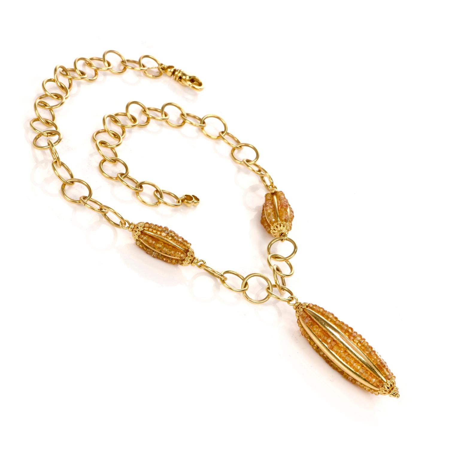  This Italian necklace is crafted in 14-karat yellow gold, weighing 29.6 grams and measuring 16.5 inches long. The elongated oval-shaped pendant measures 2 inches long and 15 mm wide, adorned with 5 rows of citrine beads. The necklace is composed of