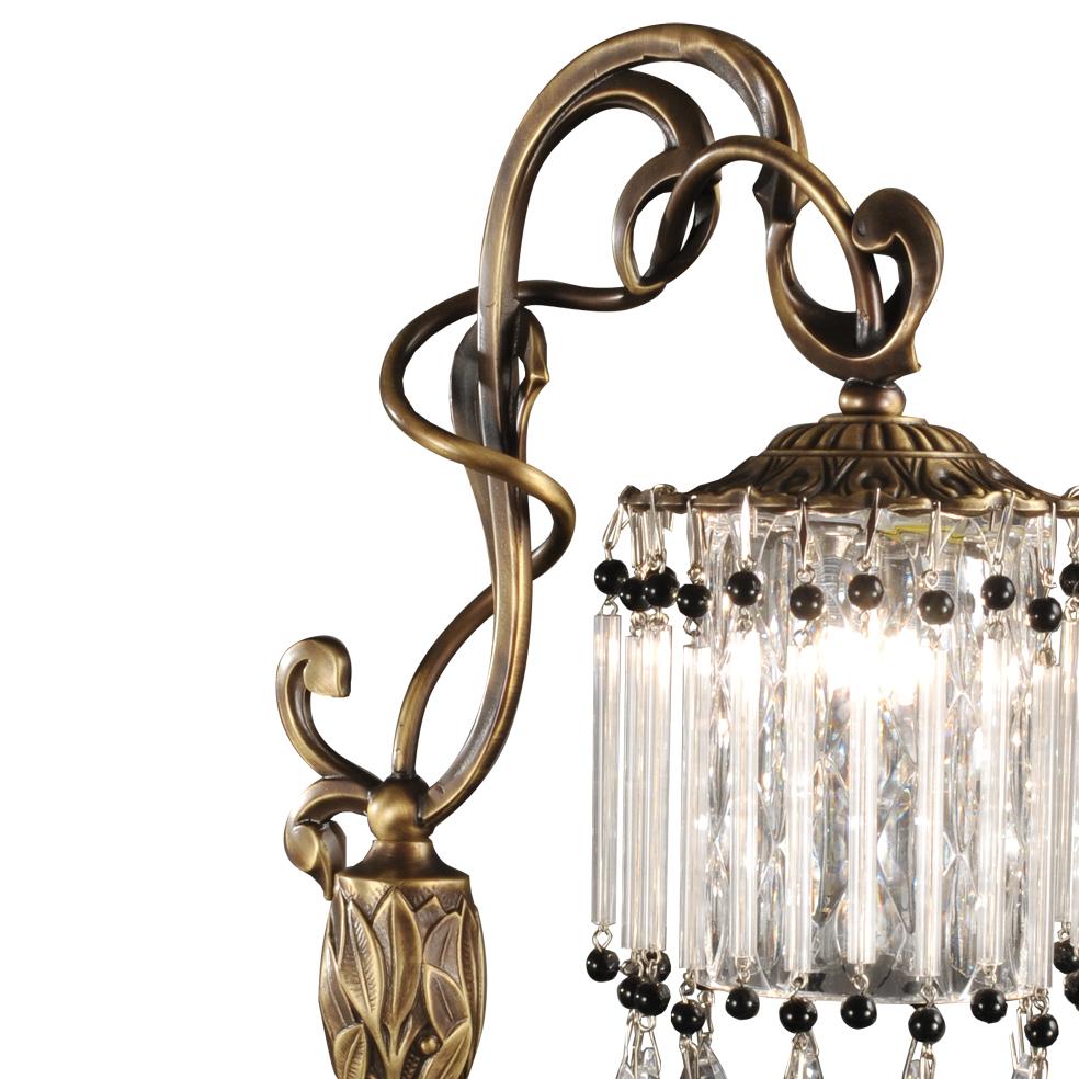 Clear crystal and burnished bronze table lamp in Liberty style. The pendant are in clear and black crystal. Each object is handcrafted and the care for every detail makes each item unique in its kind.
Also Oggetti d'Arte will follow with the same