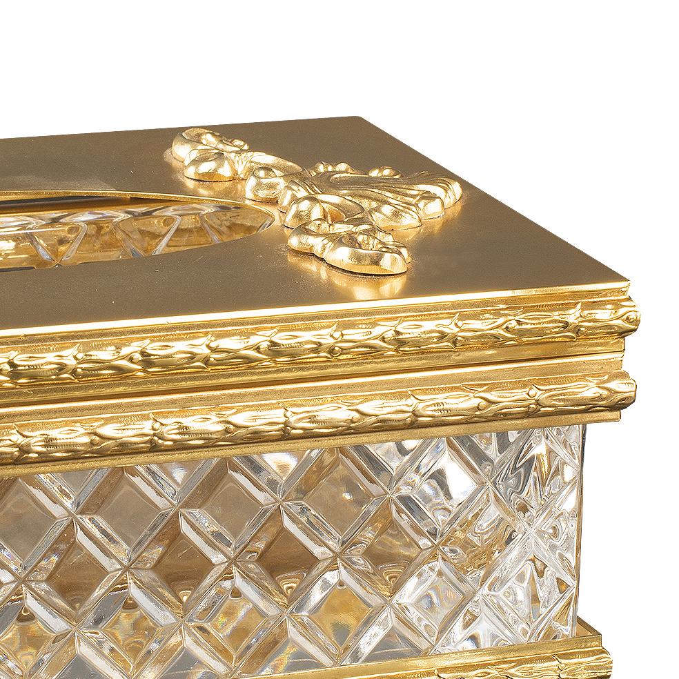 Hand carved clear crystal and patinated golden bronze clinex-holder. Each object is handcrafted and the care for every detail makes each item unique in its kind.
The style of this Klinex-holder is a modern reinterpretation of an object from the