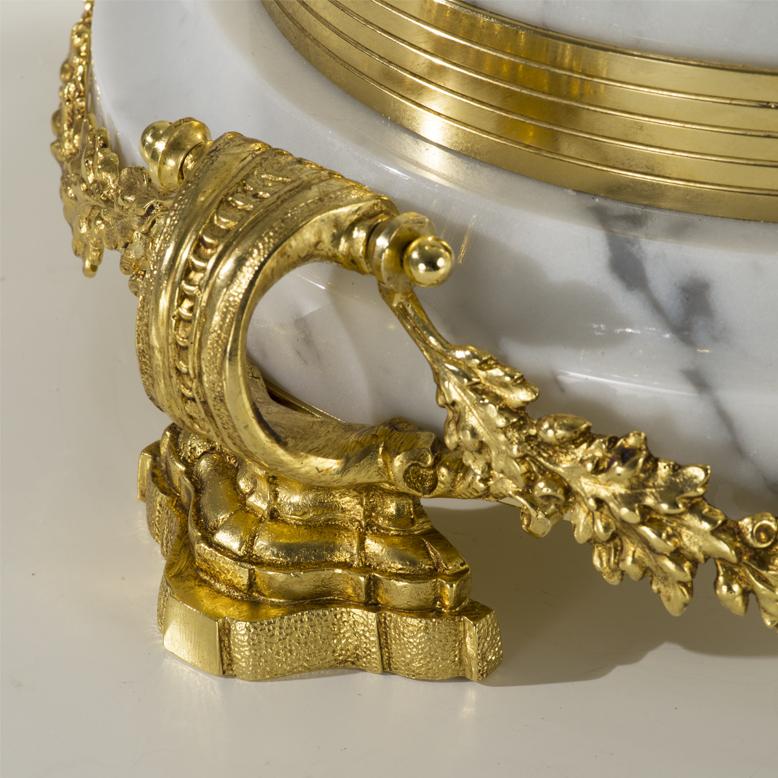 21st century  clear hand-carved crystal and golden bronze bowl. The three figures representing the Venuses are made with the lost wax casting technique and then finely chiselled.  The base is in white carrara marble. On request to customer can