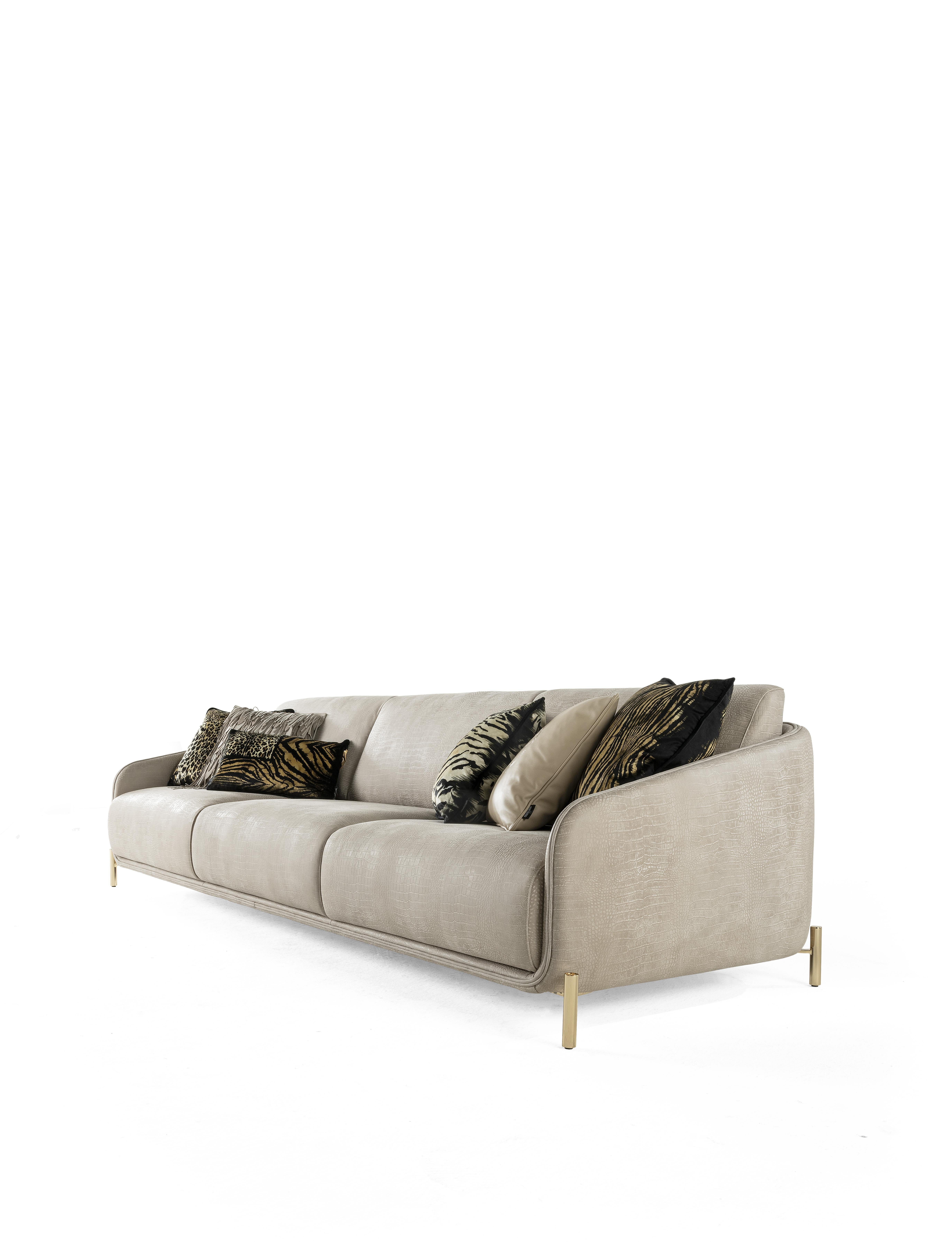 A one-of-a-kind, sensual sofa - the perfect expression of the true essence of the brand. Upholstered in a new textural and luxurious fabric, the sofa is enriched with cushions with animalier patterns, that wink at the wildest spirit of Roberto