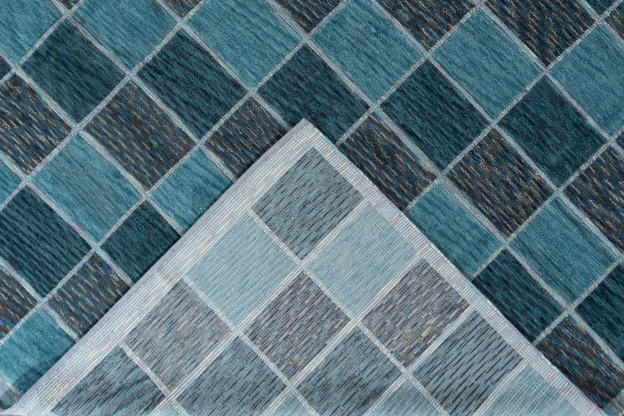 A 21st century contemporary flat-weave/pile rug with a blue geometric all-over design. Custom sizes are available.

Material: Wool
Lead time: Approximately 12 weeks
Available colors: As shown; other custom colors and styles available.
Made in