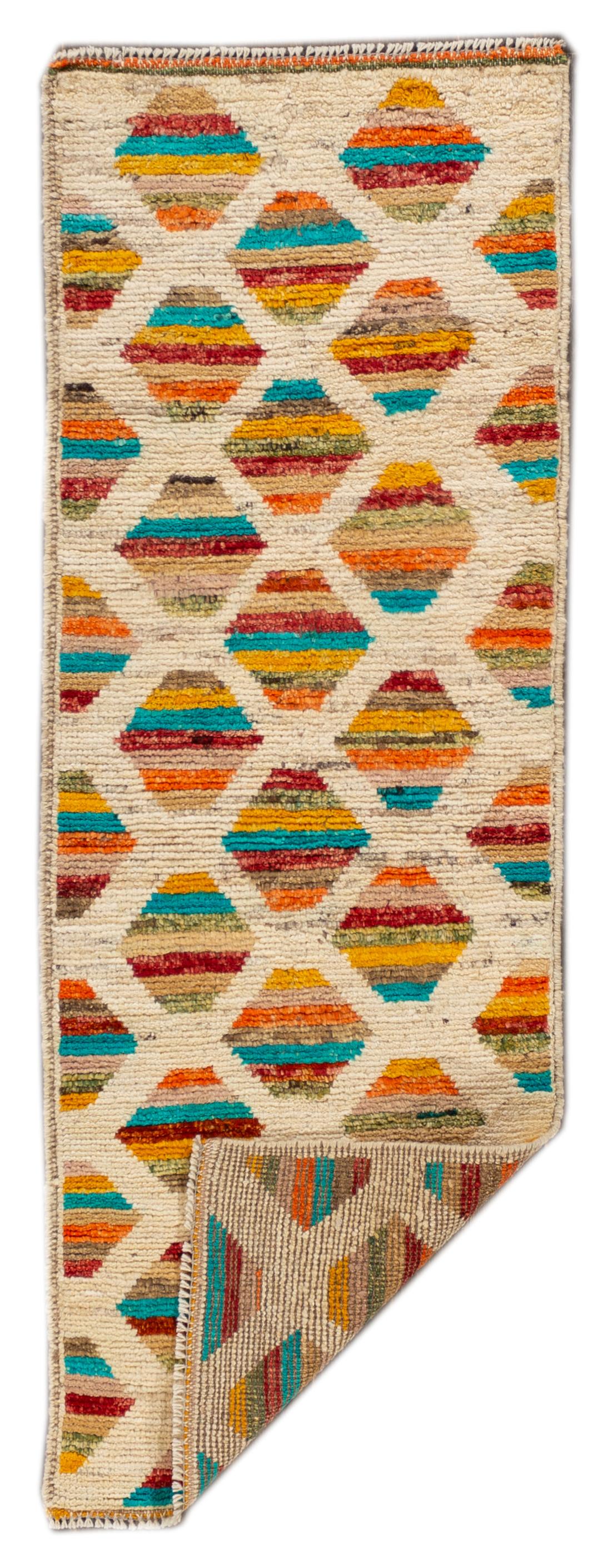 Beautiful contemporary Gabbeh style runner rug with an ivory field, multi-color accents in an all-over geometric pattern, circa 2018.
This rug measures 1' 9