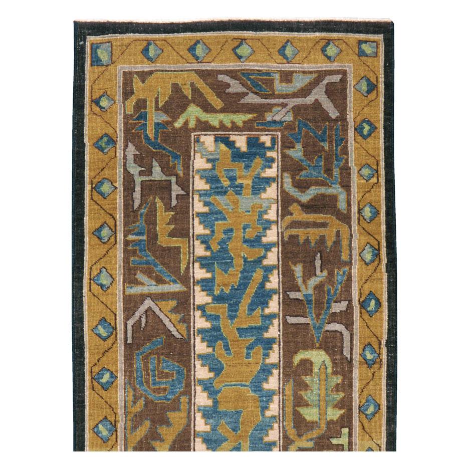 A modern Persian Tabriz runner handmade during the 21st century utilizing repurposed wool from antique and vintage rugs to generate a very high-quality contemporary piece with the patina of a period rug. The abstract pattern is a play on classic