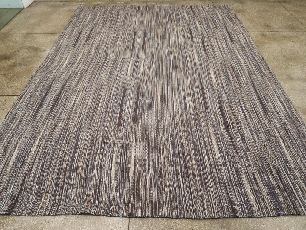 A modern rustic Turkish Flatweave room size carpet handmade during the 21st century.

Measures: 10' 8