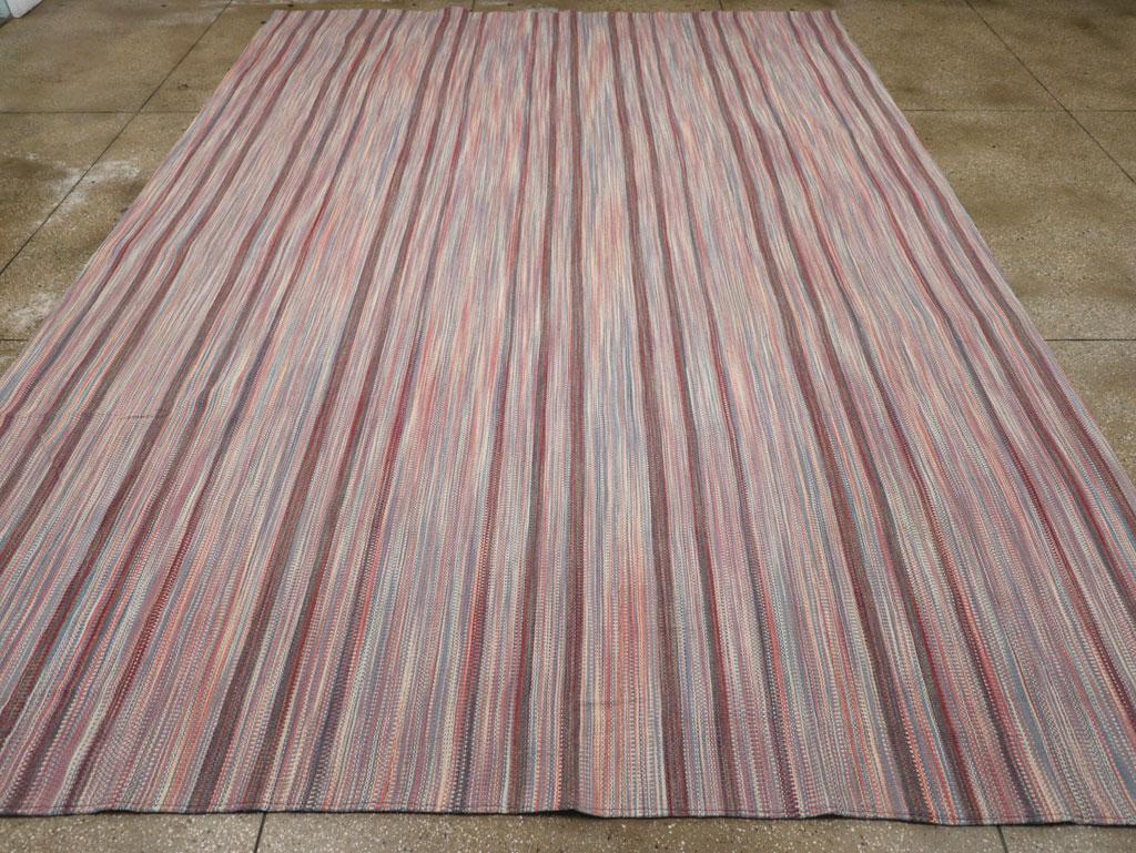 A modern Turkish flatweave room size carpet handmade during the 21st century.

Measures: 10' 9