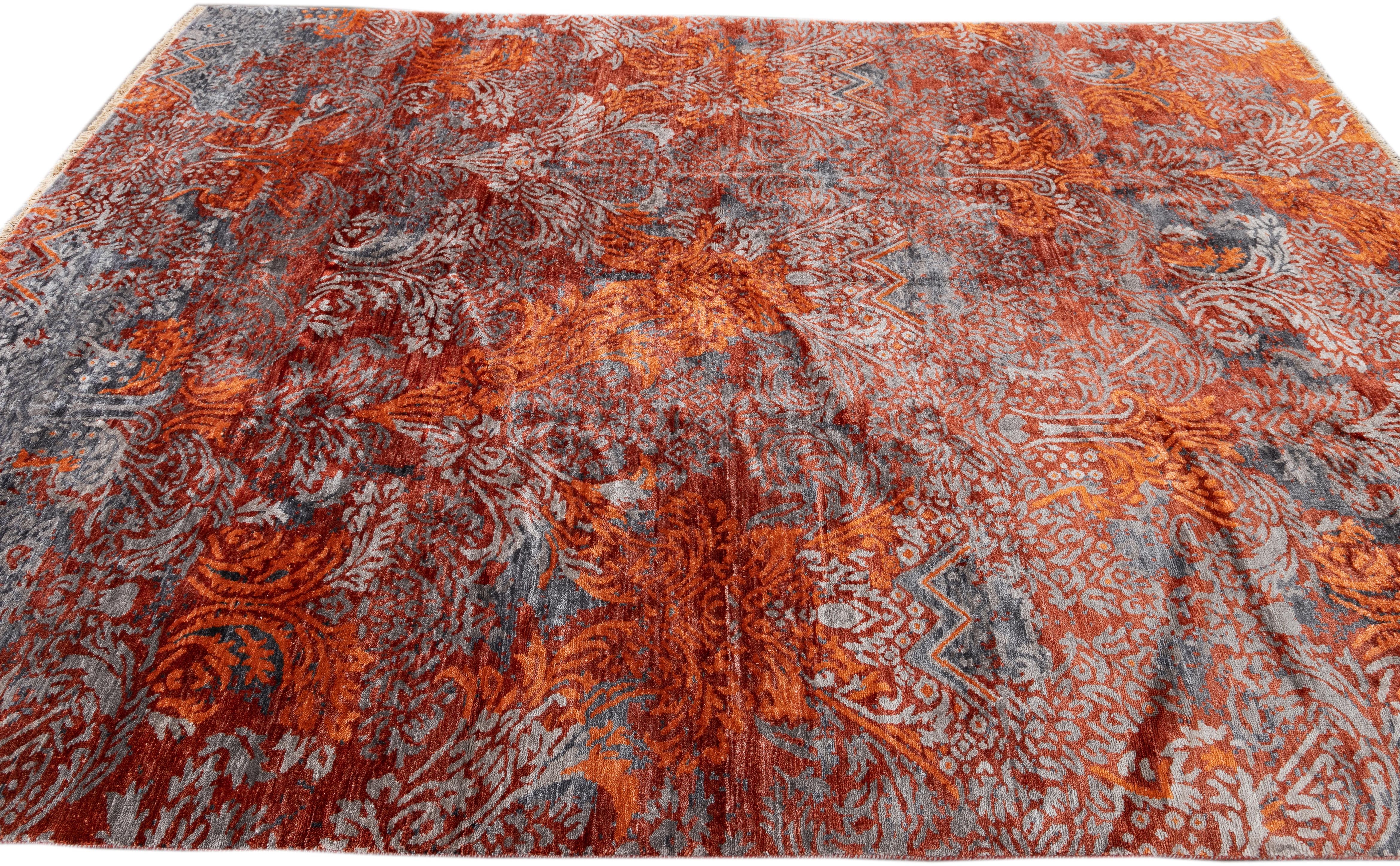 This contemporary Indian rug showcases a rusted allover pattern set against a gray field, crafted from high-quality wool and silk. 

This rug measures 8' x 10'.