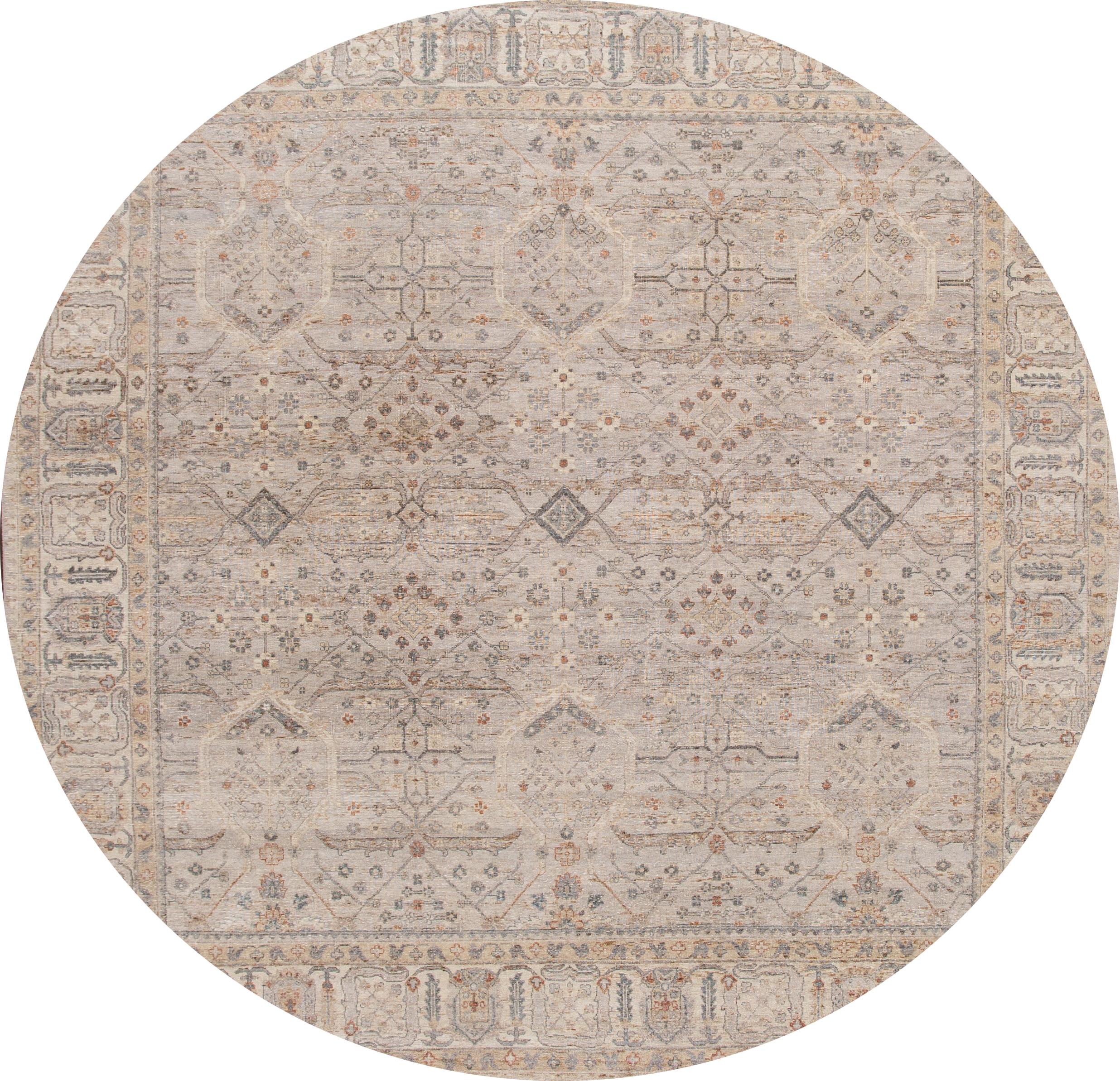 Beautiful modern hand knotted Square Indian wool rug with a beige field, ivory, brown, and peach accents with an all-over geometric design.

This rug measures 10' 1