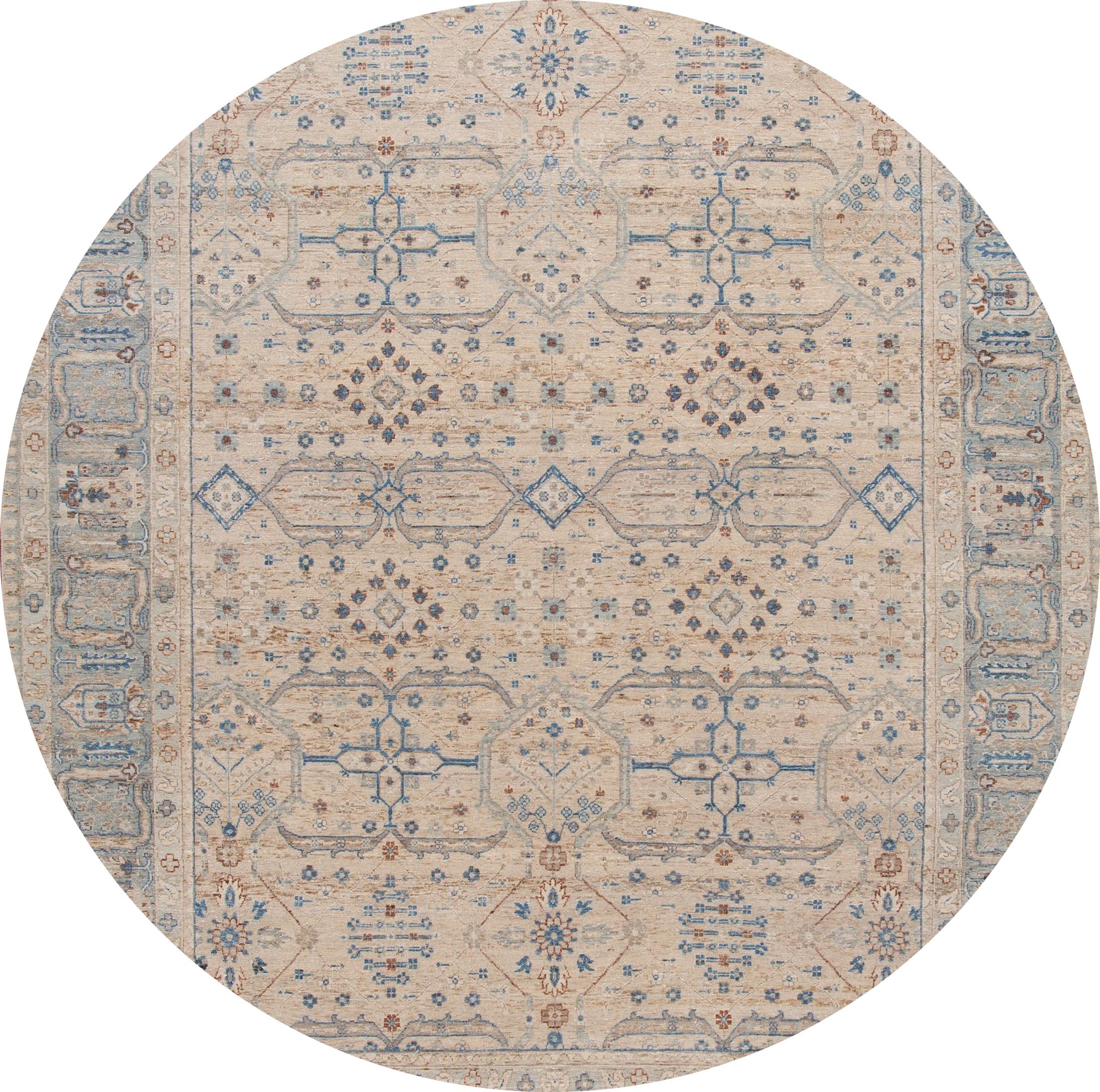 Beautiful modern hand knotted Indian wool rug with a beige field, blue, brown, and ivory accents with an all-over geometric design.

This rug measures: 9' x 12' 1