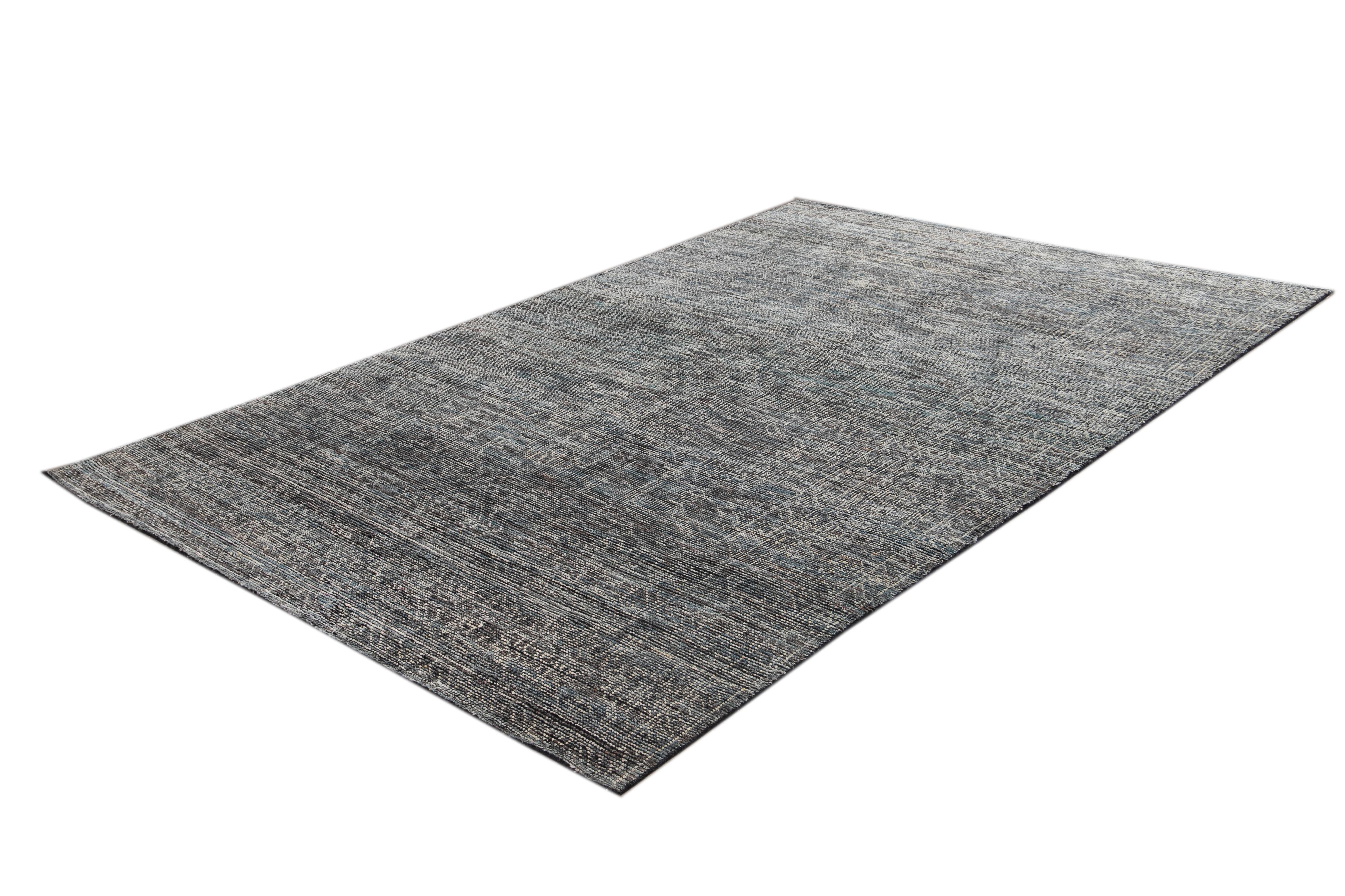 Beautiful Modern Soumak Style Distressed Indian Rug, hand-knotted wool with a gray field, denim and ivory highlights in a subtle allover multi medallion design.

This rug measures 6' 6