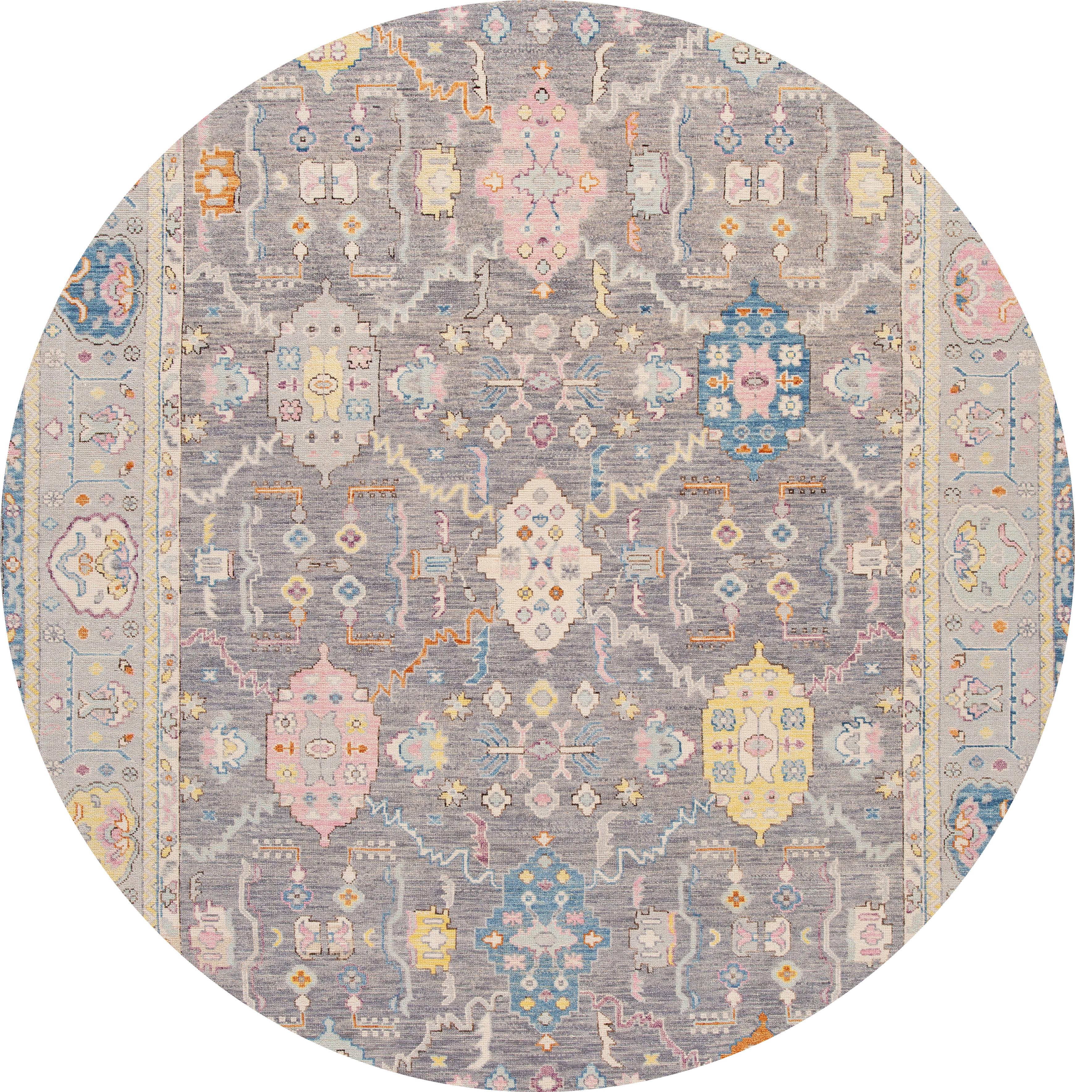 Beautiful contemporary Oushak rug, hand knotted wool with a gray field, and multicolor accents in all-over geometric design,

This rug measures: 10'3