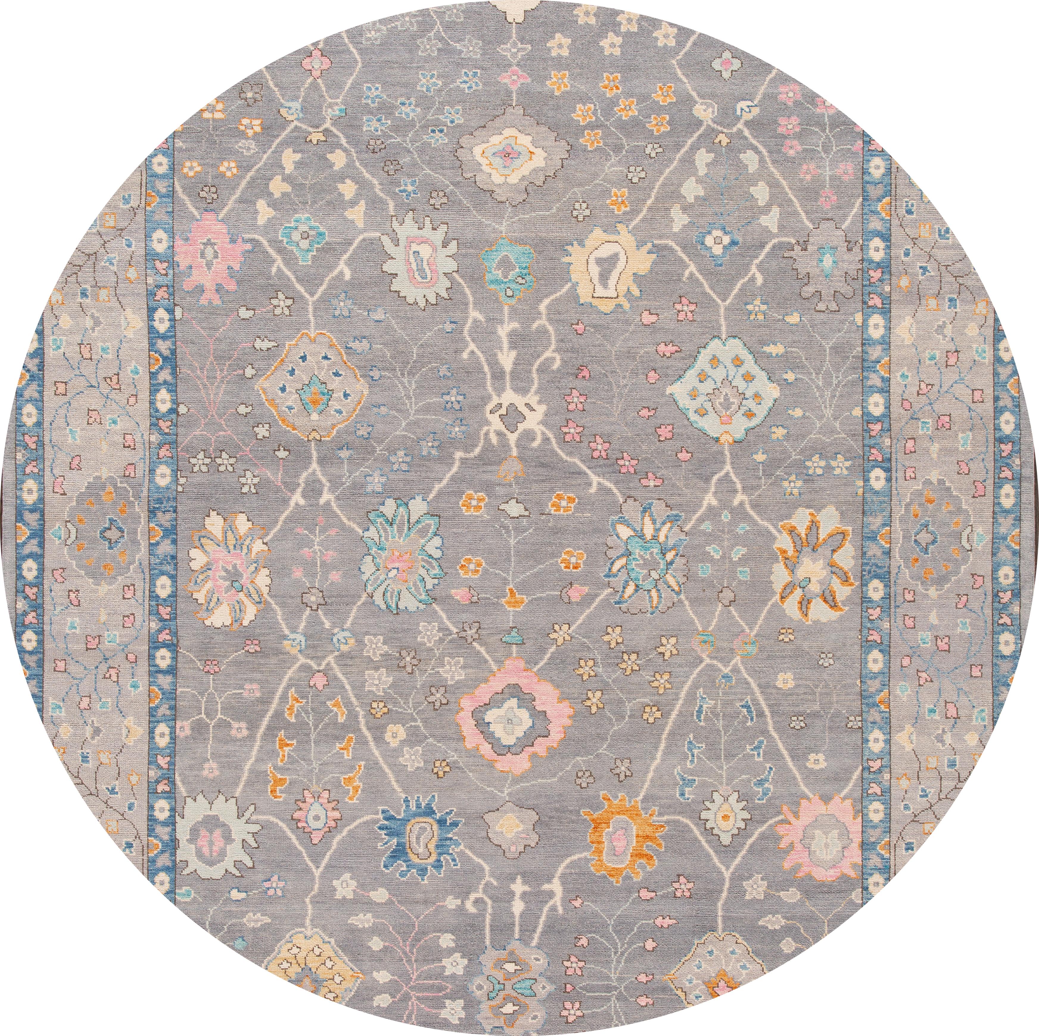 Beautiful contemporary Oushak rug, hand knotted wool with a gray field, and multi-color accents in all-over floral design,

This rug measures: 10'1