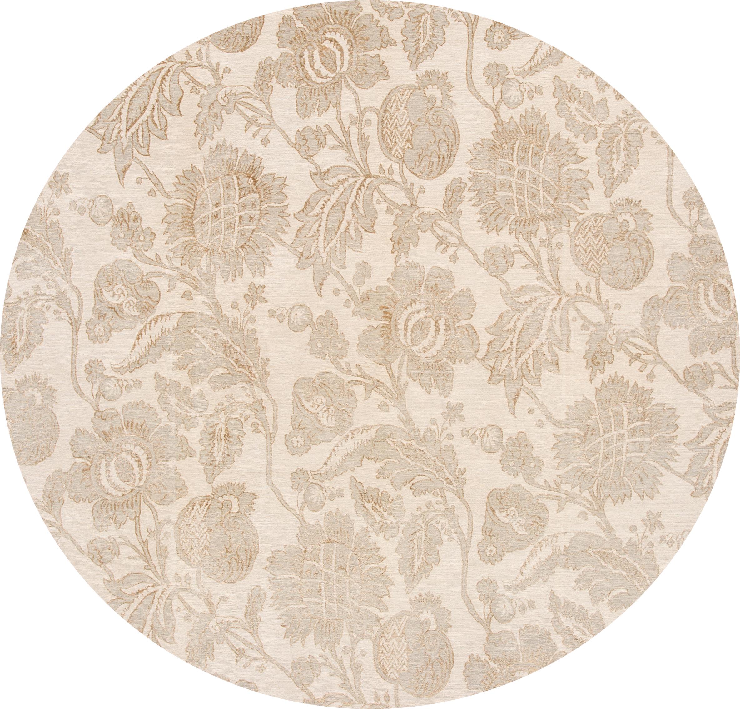 21st century contemporary Nepalese Lapchi rug, blend of wool, and silk, with an ivory field. Accents of beige on a floral design.
This rug measures: 8' x 10'1”.
 
